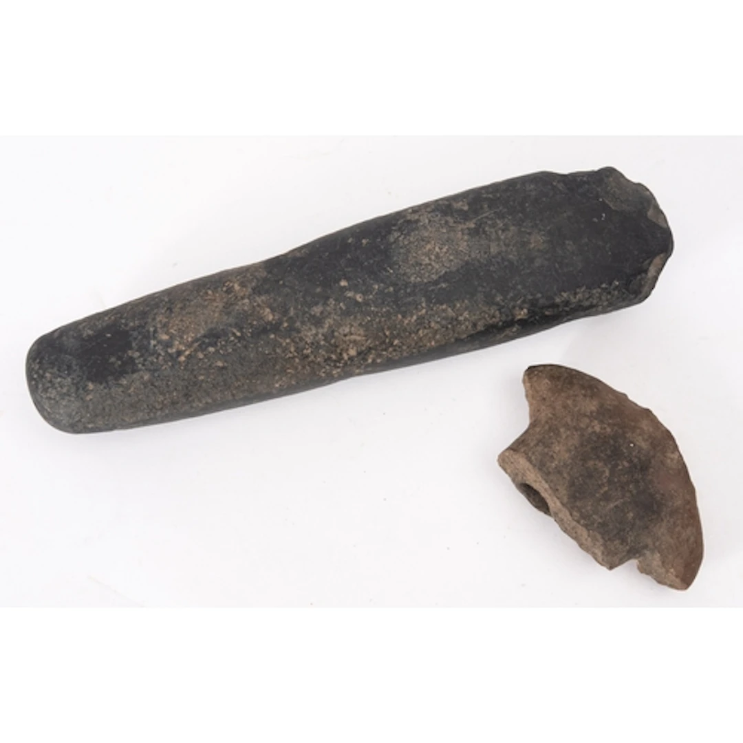 A possibly Neolithic axe head of elongated oblong form, fini...