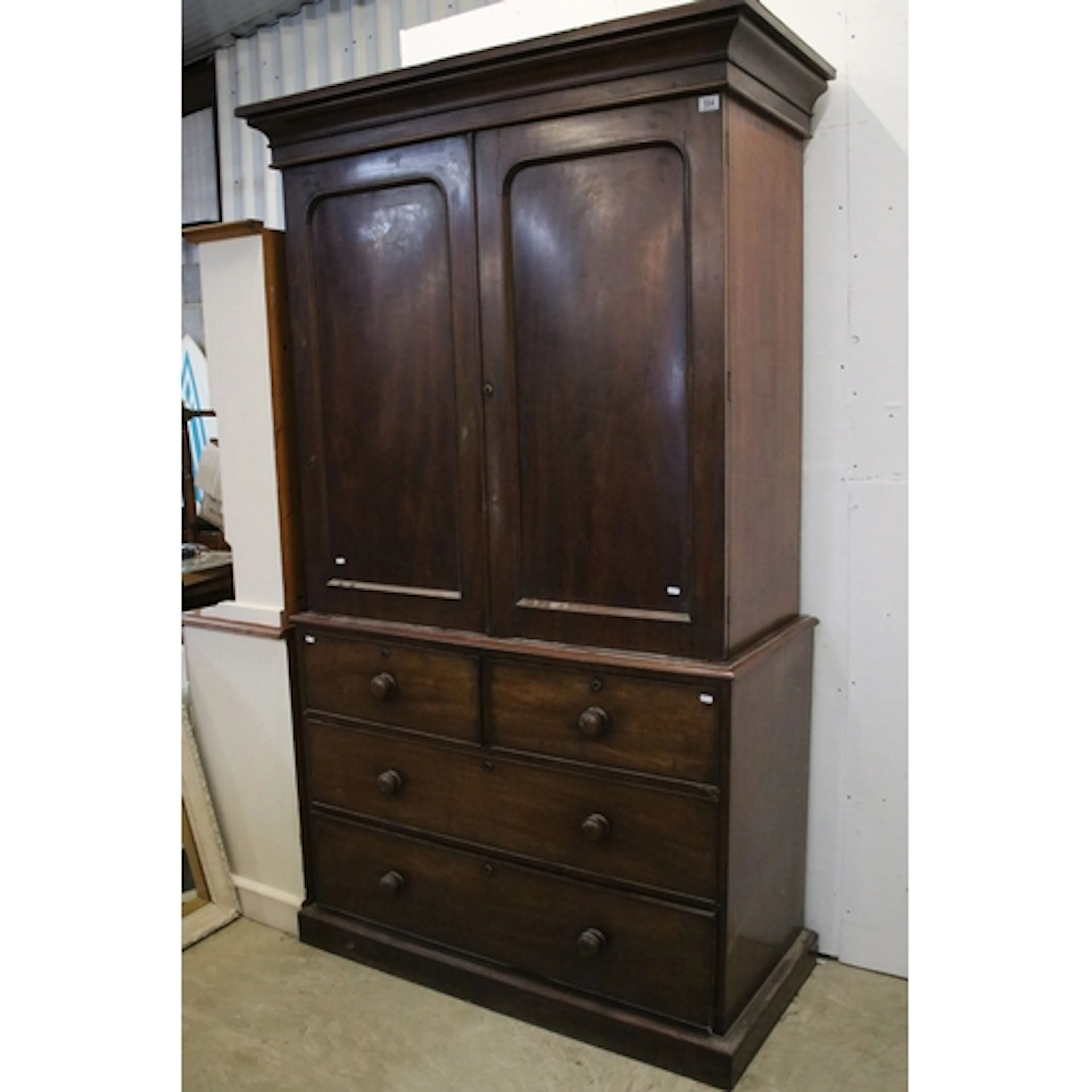 19th century mahogany linen press, the top housing slides up...