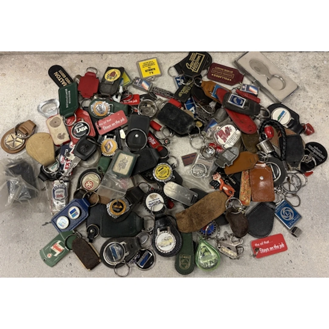 A collection of motoring related keyrings. Est. £20 - £30.