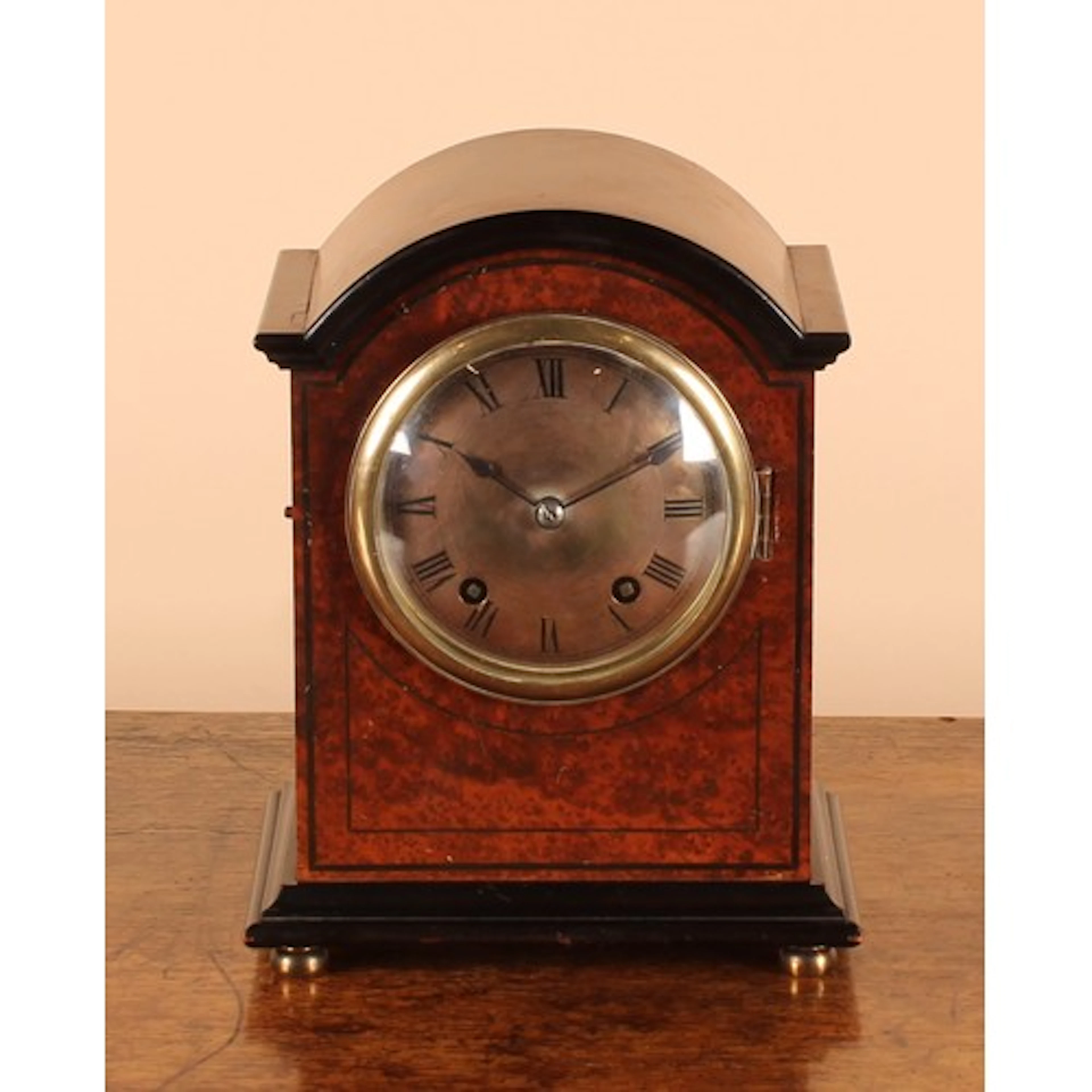 An early 20th century amboyna table or mantel clock, 10.5cm ...