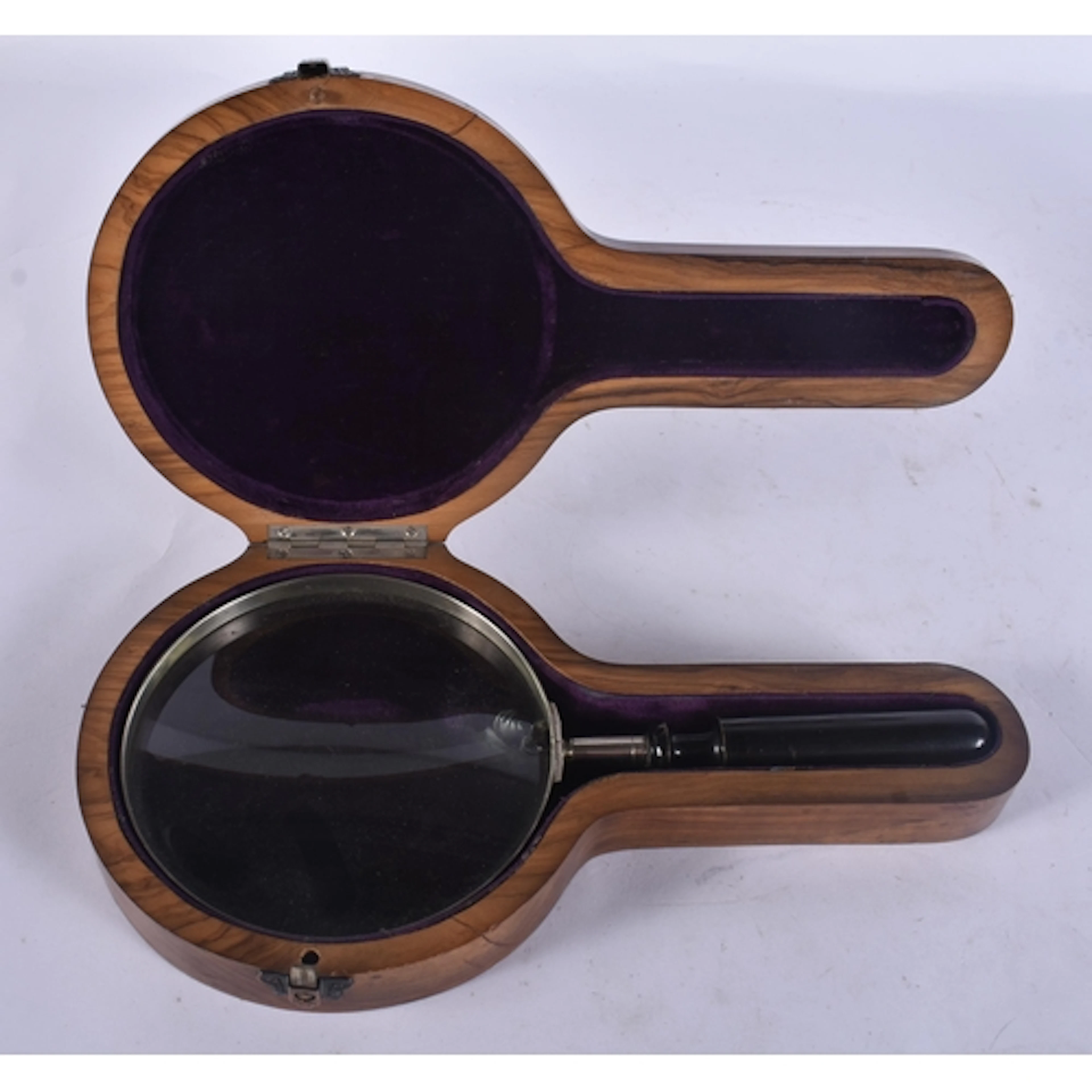 AN ANTIQUE MAGNIFYING GLASS contained within an olive wood c...