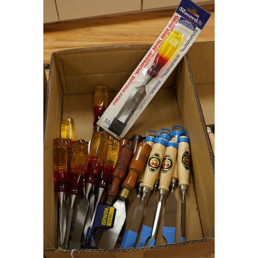 Twenty-one wood working chisels including; a graduated set o...