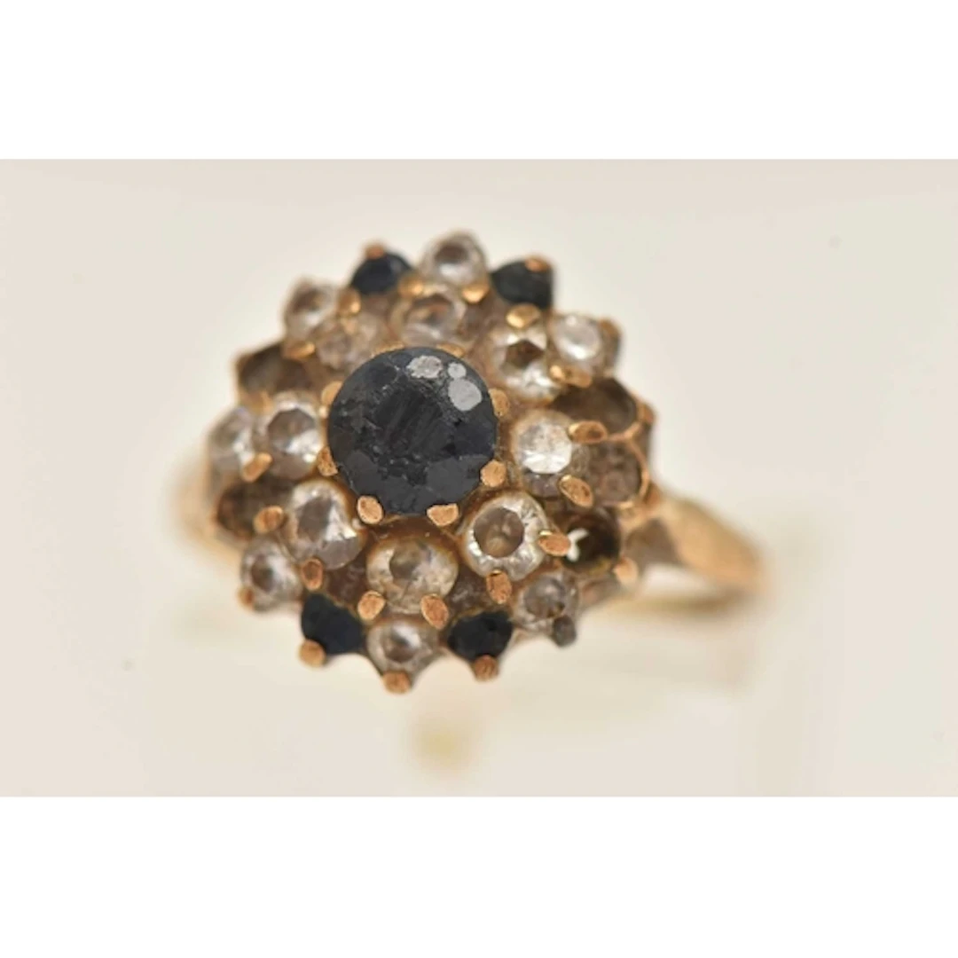 A 9CT GOLD CLUSTER RING, set with cz AF missing stones, hall...