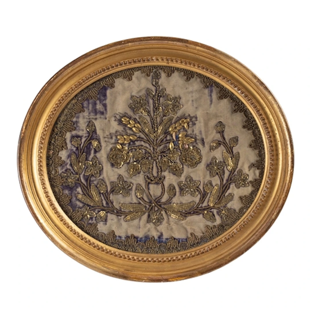 An Indian gilt-metal thread embroidered oval panel, late 18t...