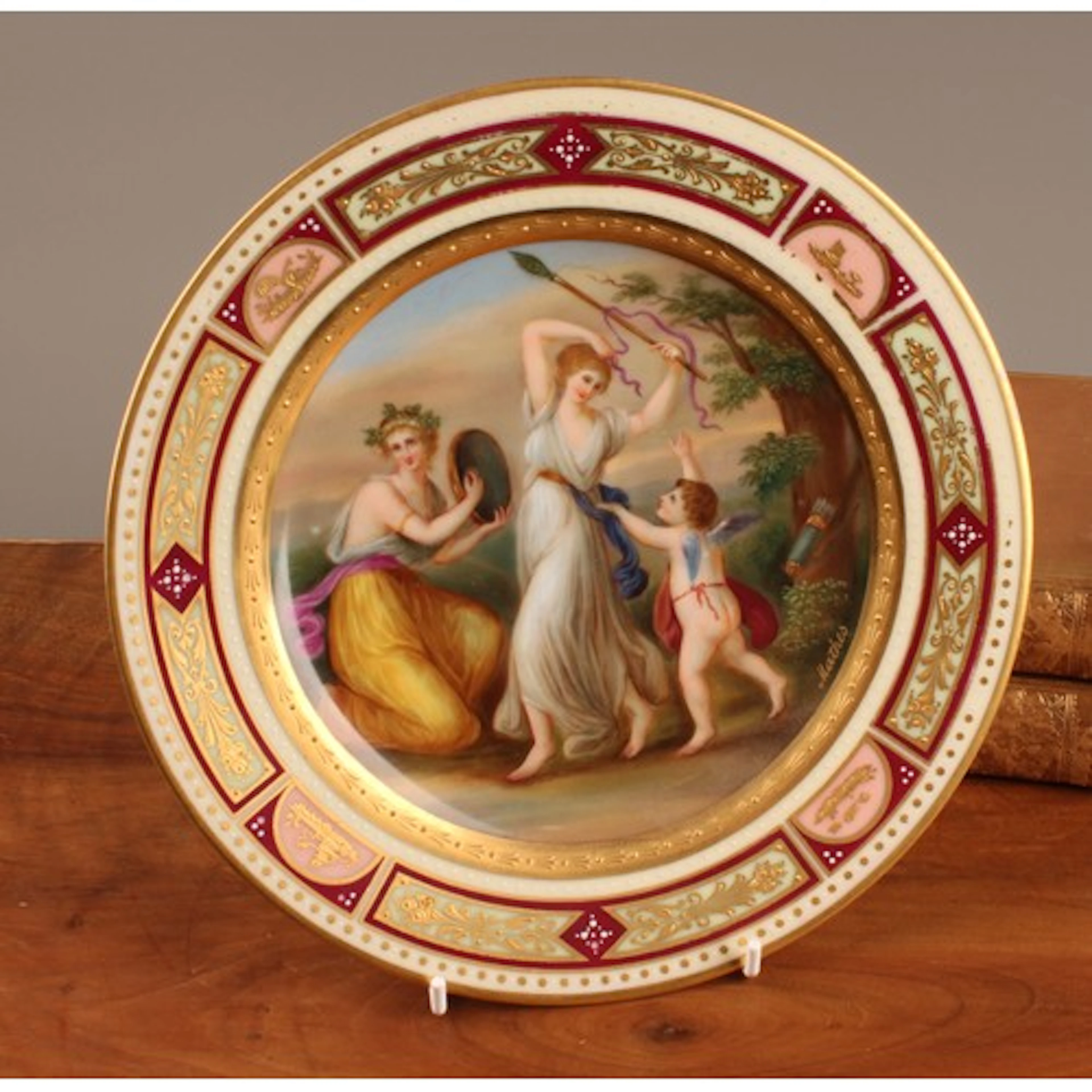A Vienna circular cabinet plate, decorated in polychrome by ...
