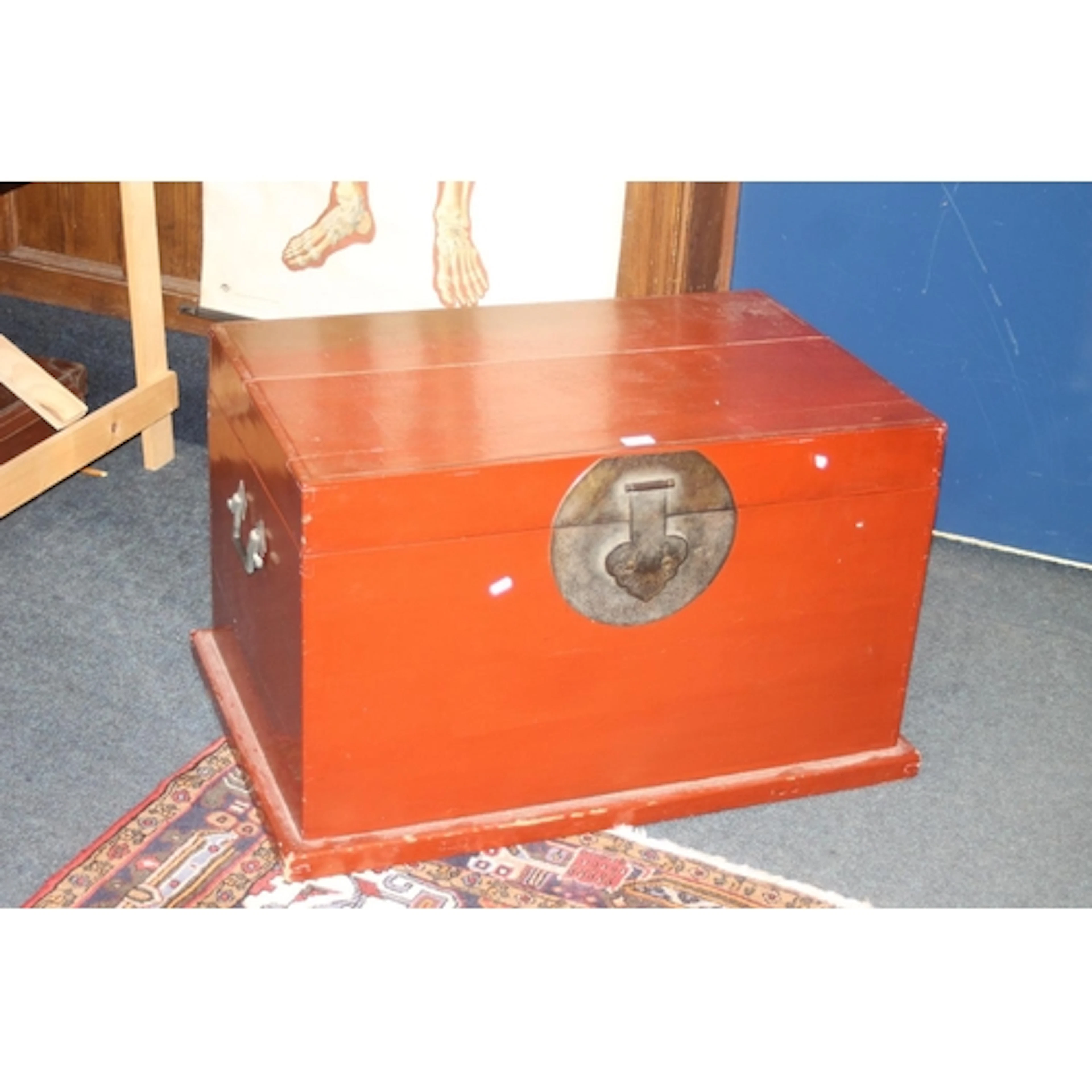 Chinese red lacquered trunk of rectangular form with brass f...