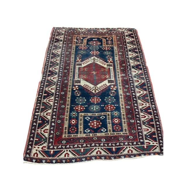 An antique Caucasian rug, 176 x 120cm