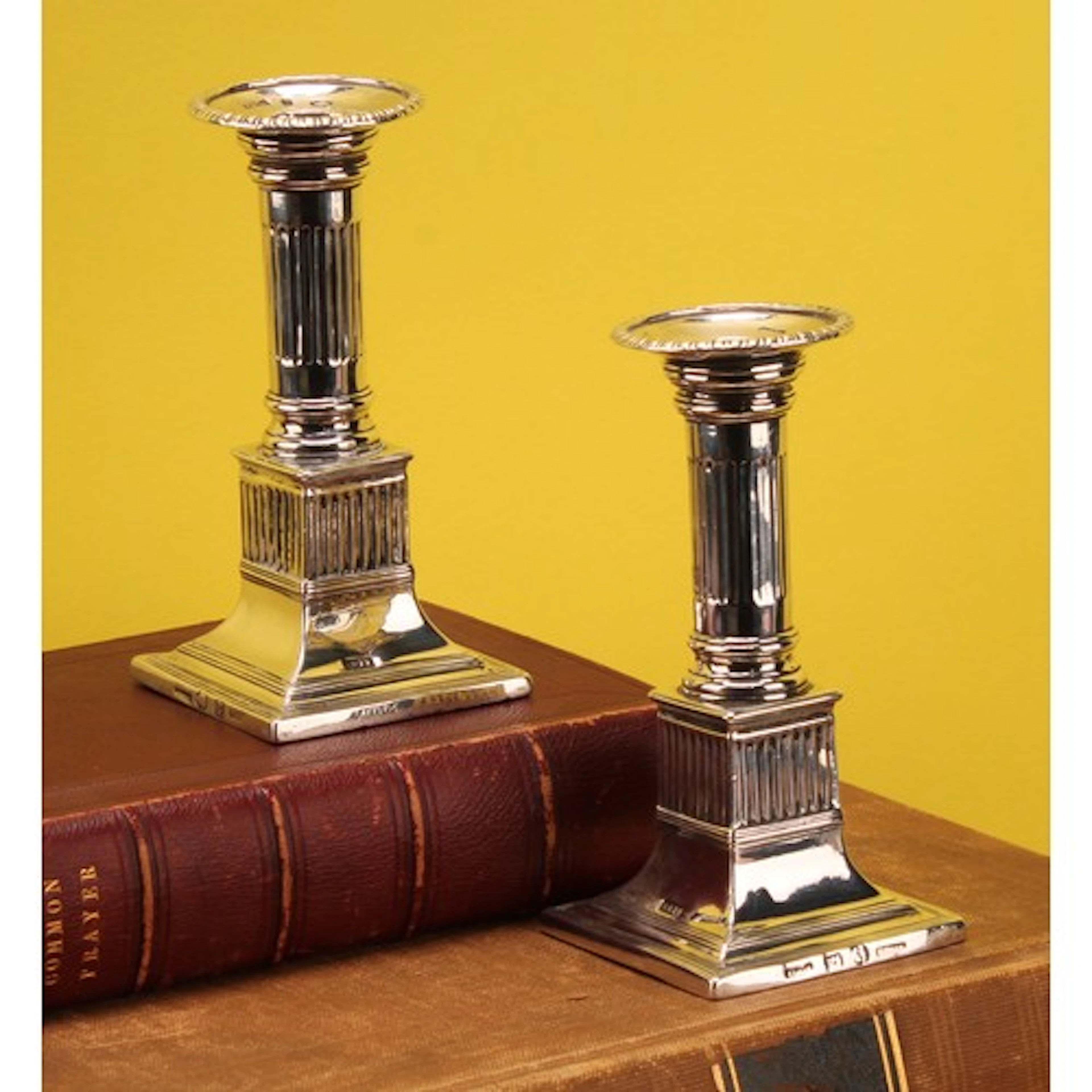 A pair of Spanish Colonial Mexican cast silver candlesticks,...
