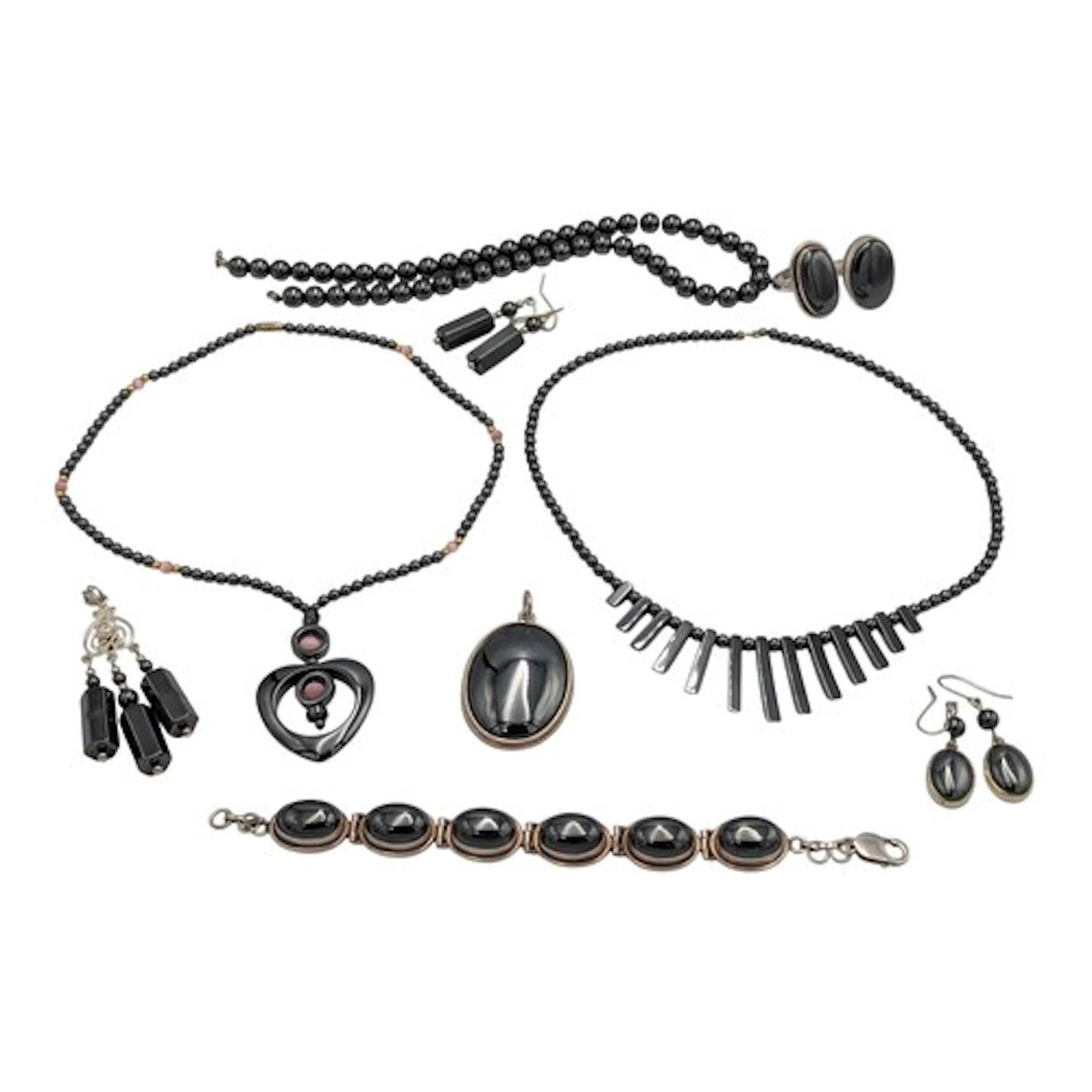 A silver mounted hematite cabochon bracelet, dress rings, ea...