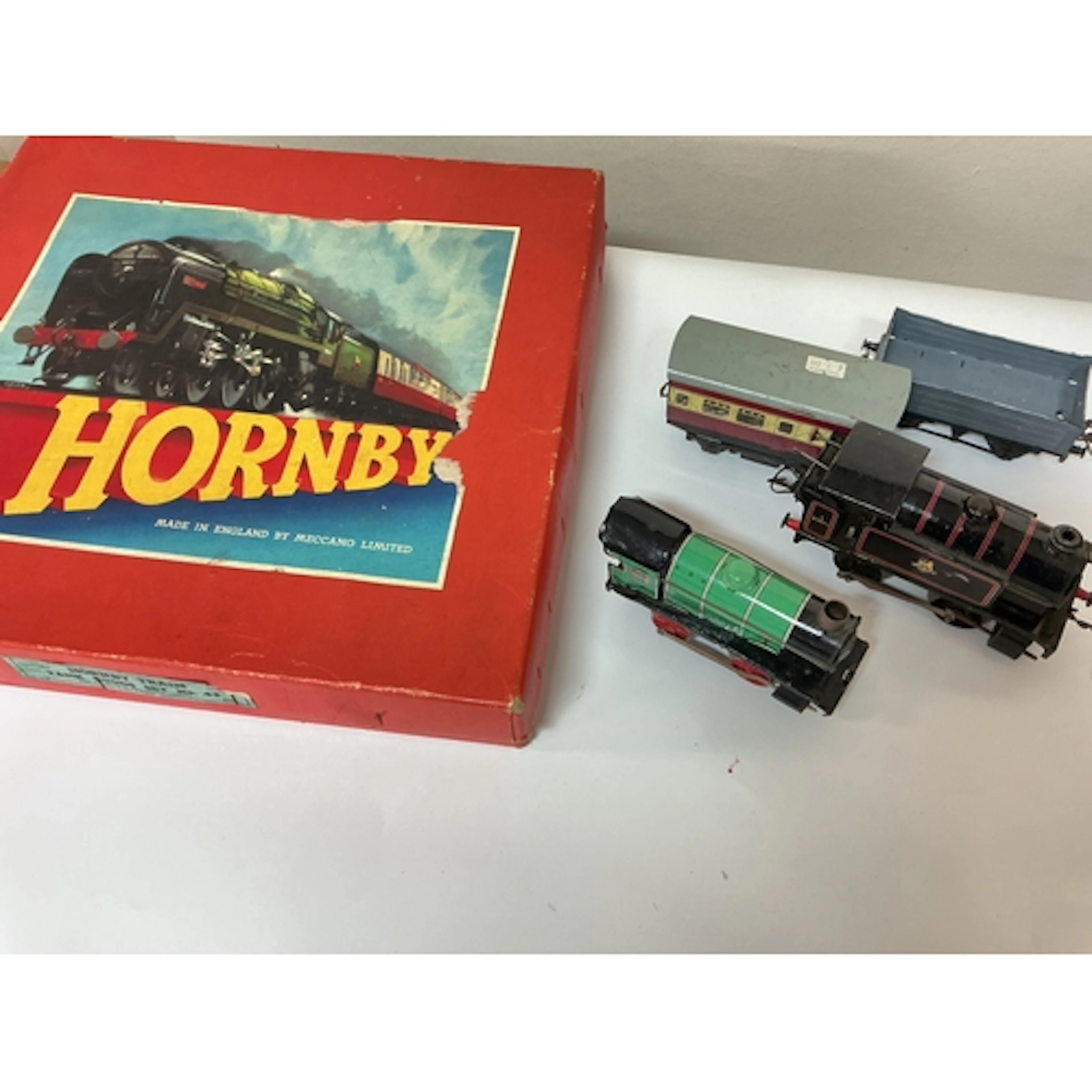 A Box Containing A Collection Of 0 Gauge Locos, wagons Etc.