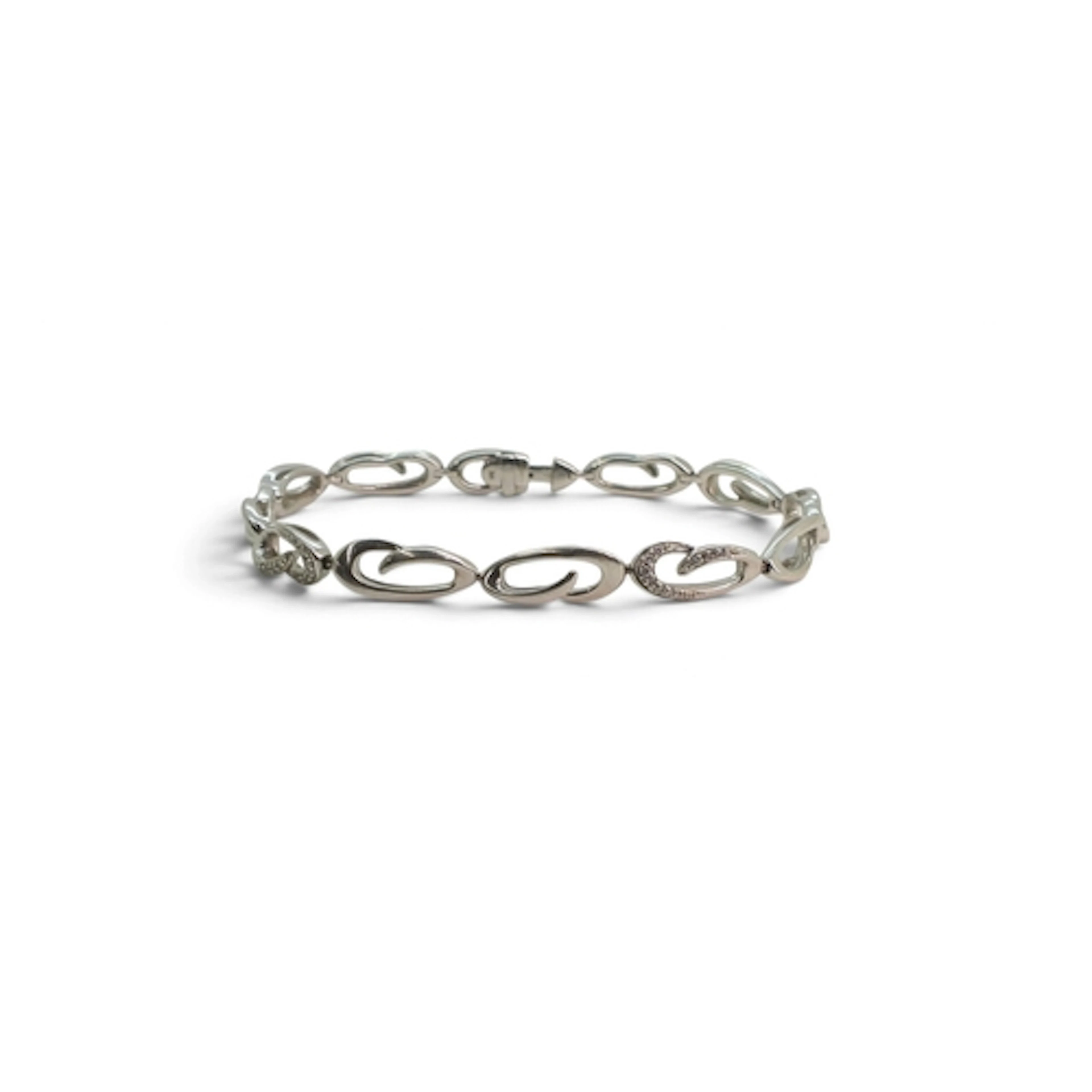 A 9ct white gold swirl link bracelet set with diamond accent...