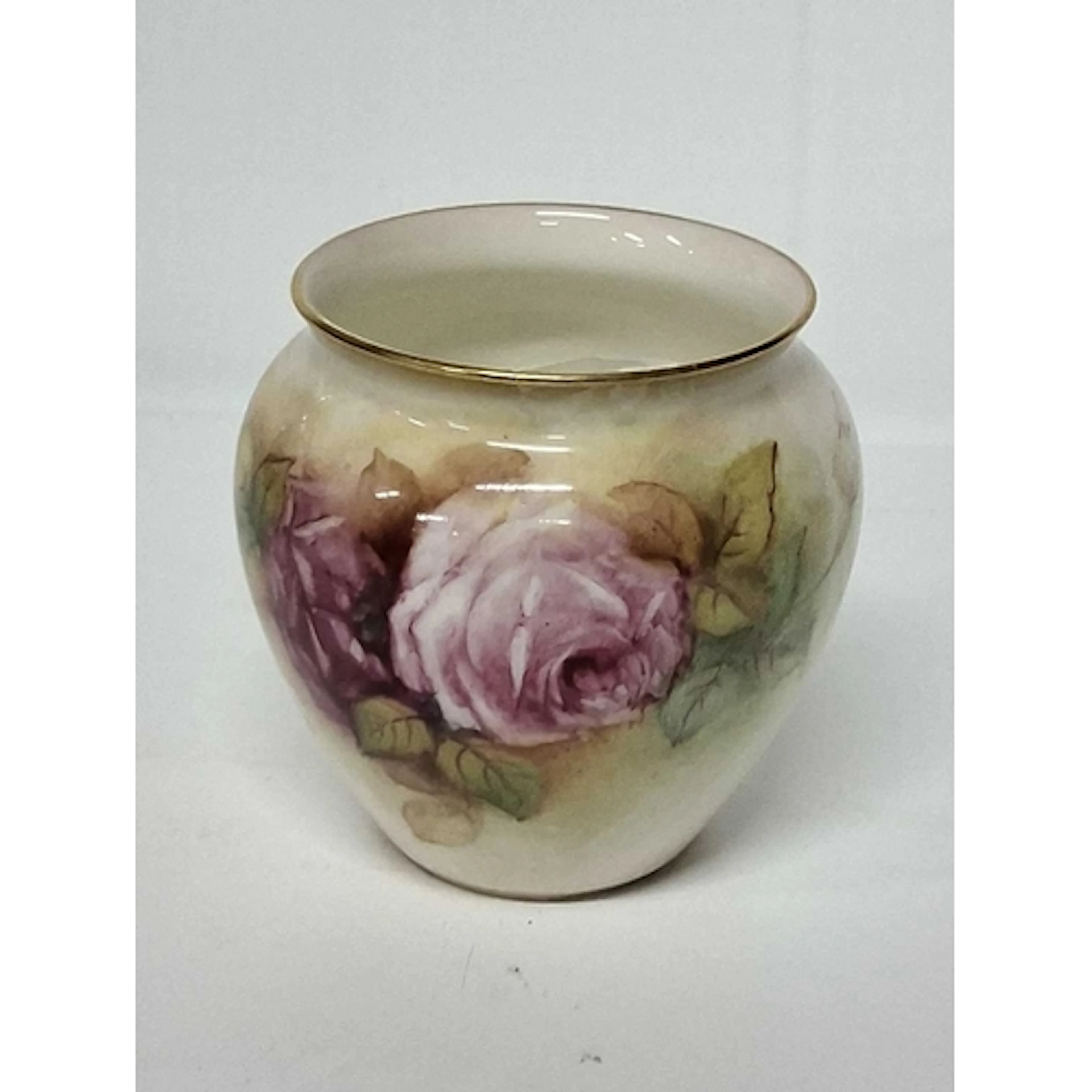 A ROYAL WORCESTER VASE PAINTED WITH ROSES, indistinctly sign...