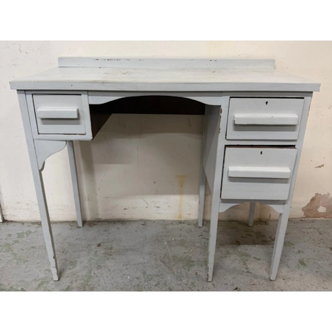 A white painted knee hole dressing table with three drawers ...