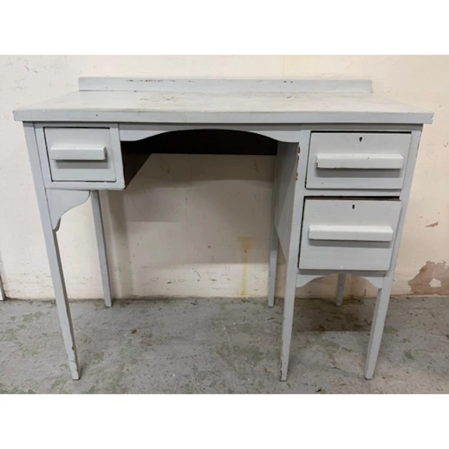 A white painted knee hole dressing table with three drawers ...