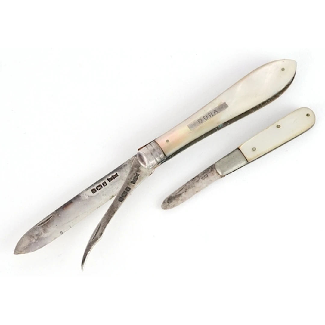 Two early 20th century silver and mother of pearl folding po...