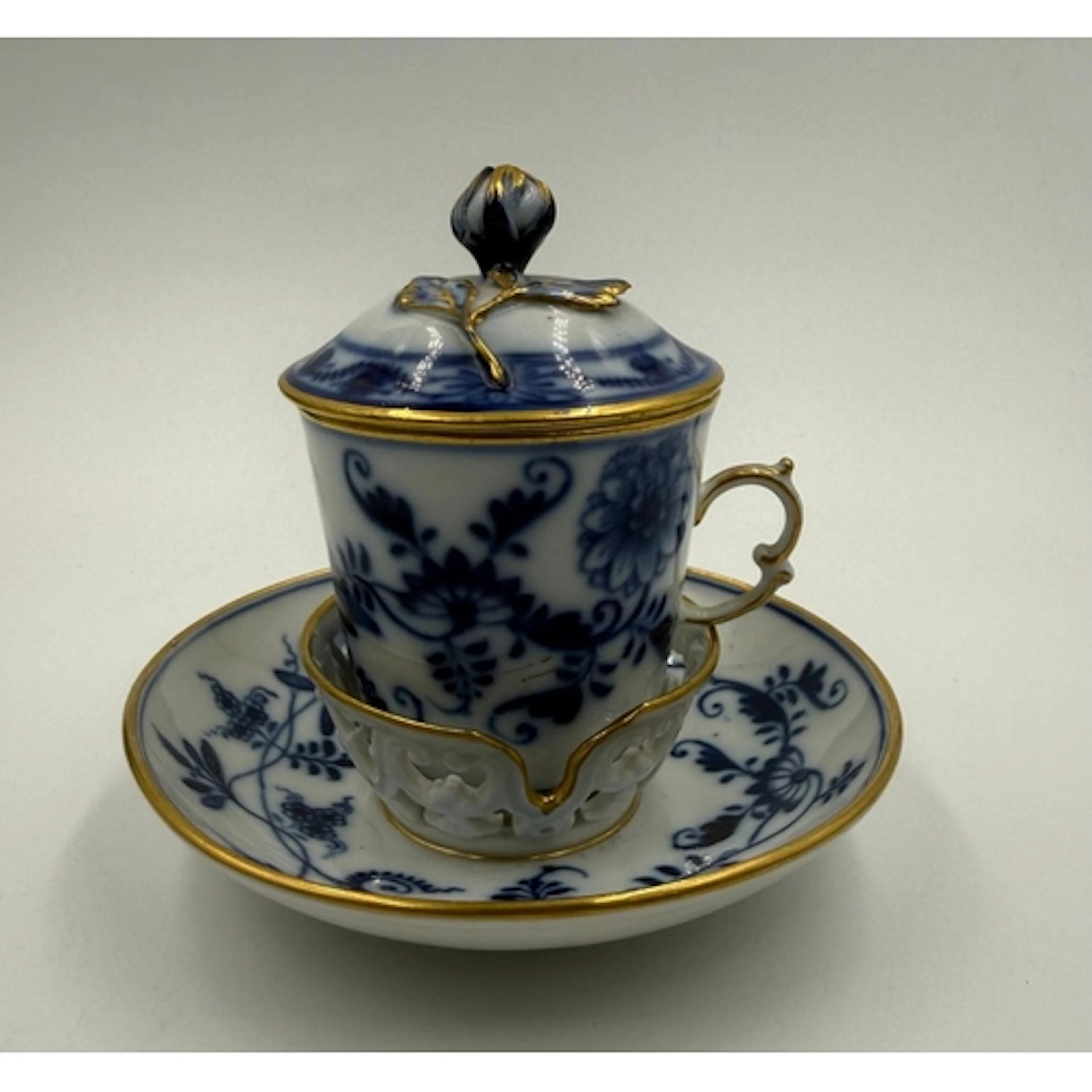 A Meissen "Blue Onion" pattern twin-handled chocolate cup wi...