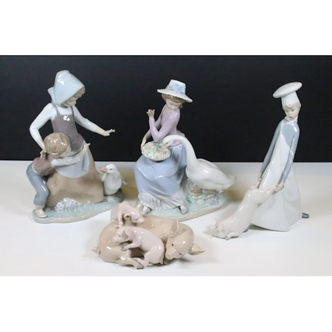 Group of four Lladro figures, to comprise 'Playful Piglets',...