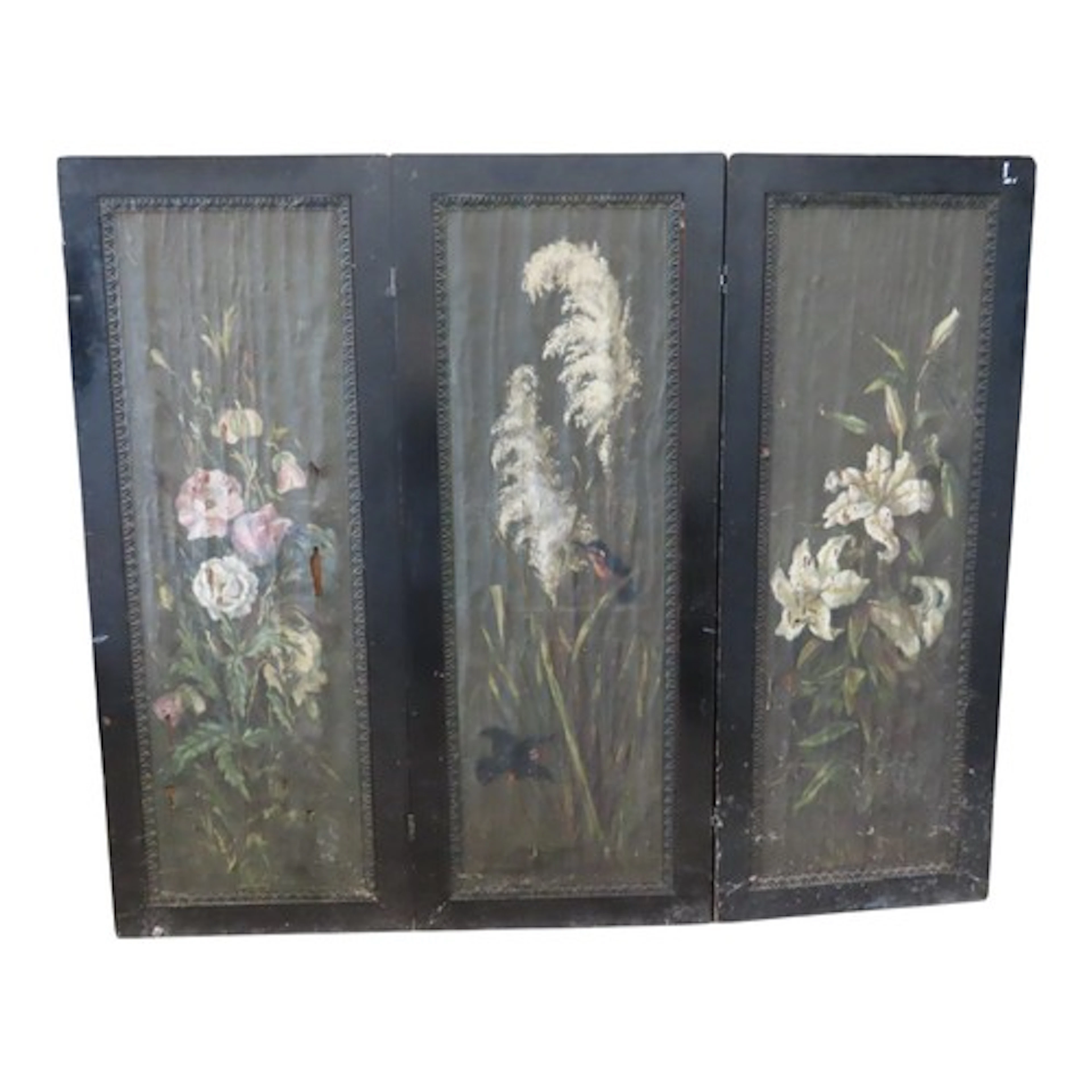 An antique freestanding ebonised three fold screen with embo...