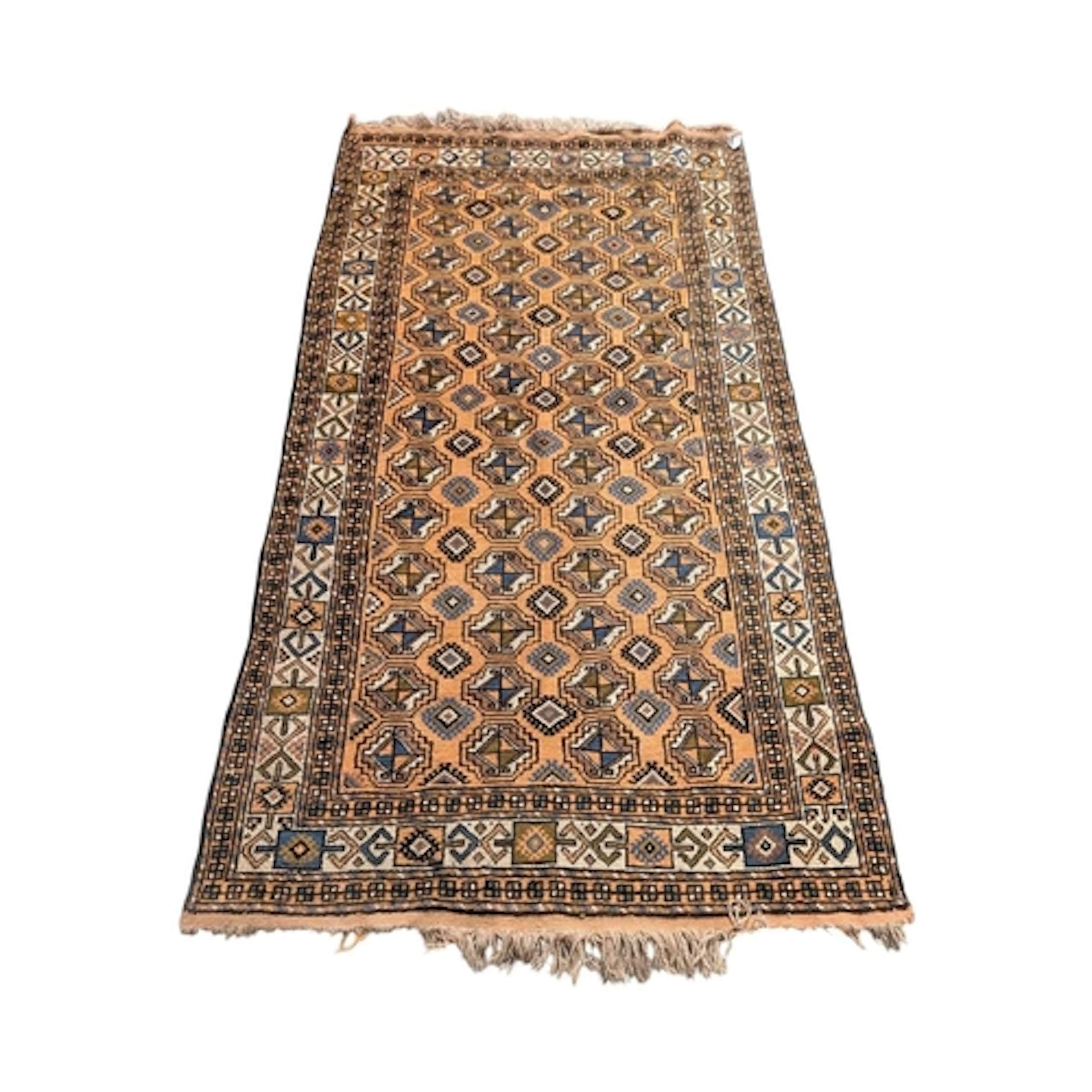 A vintage 20th century Persian Islamic Baluch carpet floor r...