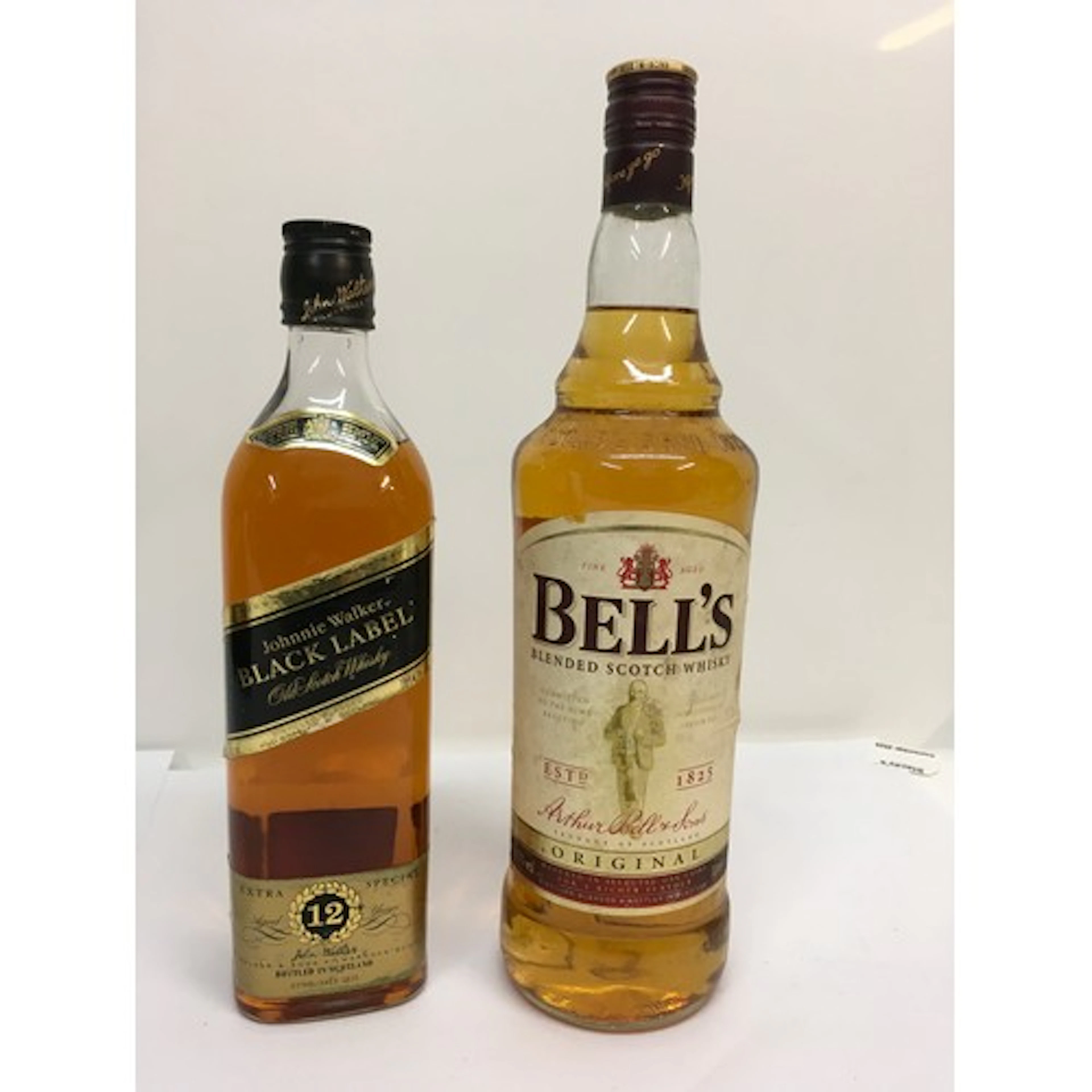 Two bottles of scotch whisky comprising Johnnie Walker Black...
