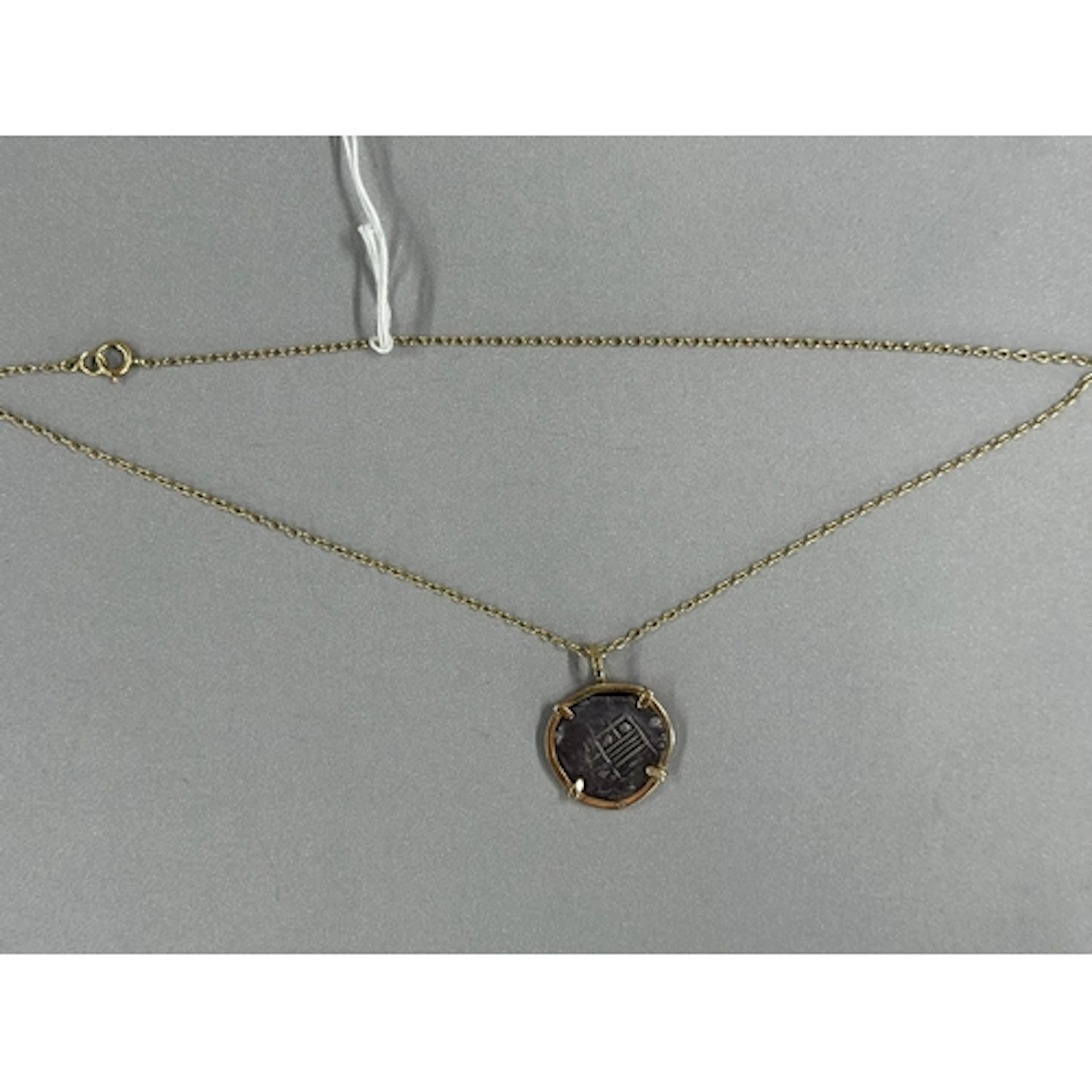Jewellery: a Spanish silver 'piece of eight' coin, around 19...