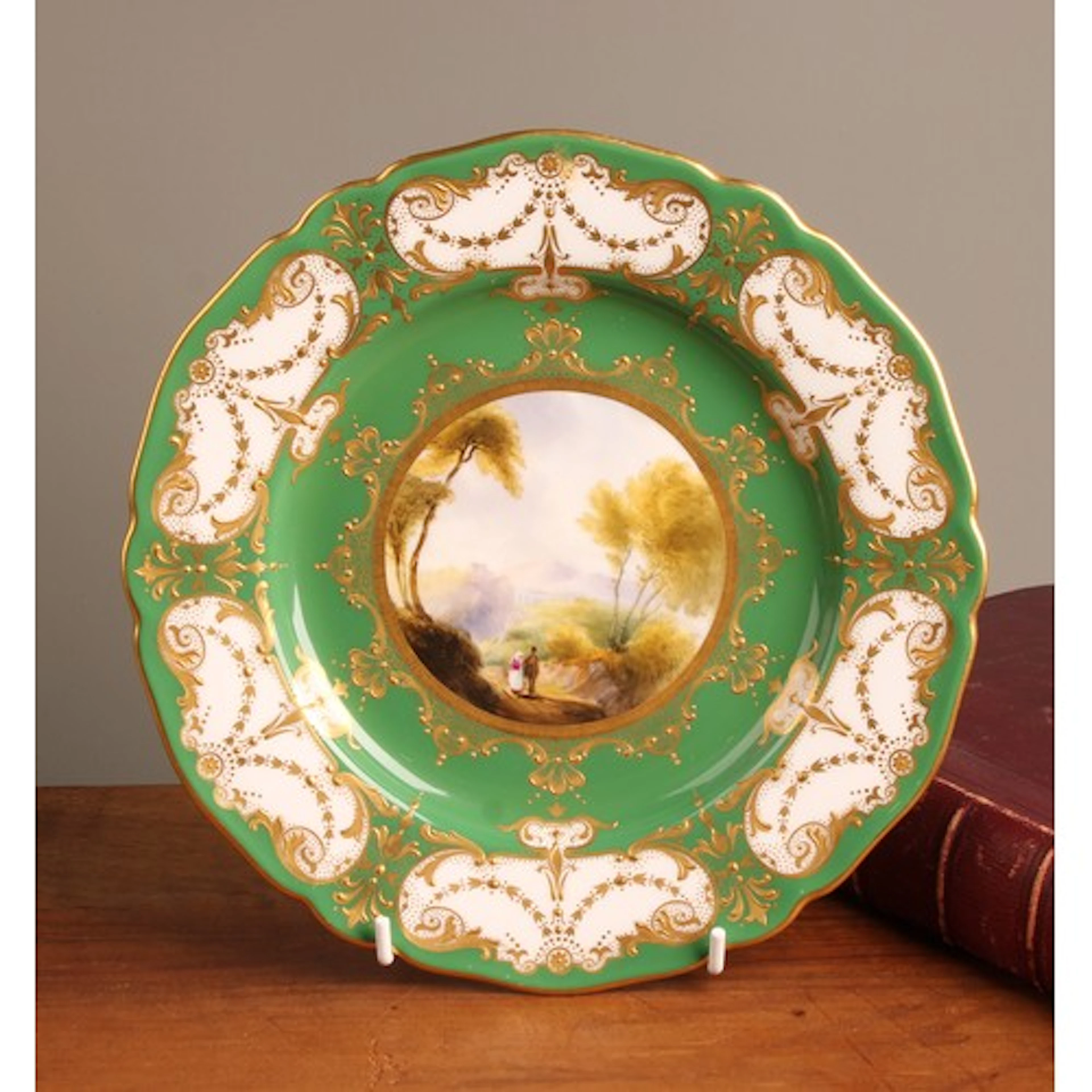 A Royal Worcester shaped circular cabinet plate by Harry Dav...