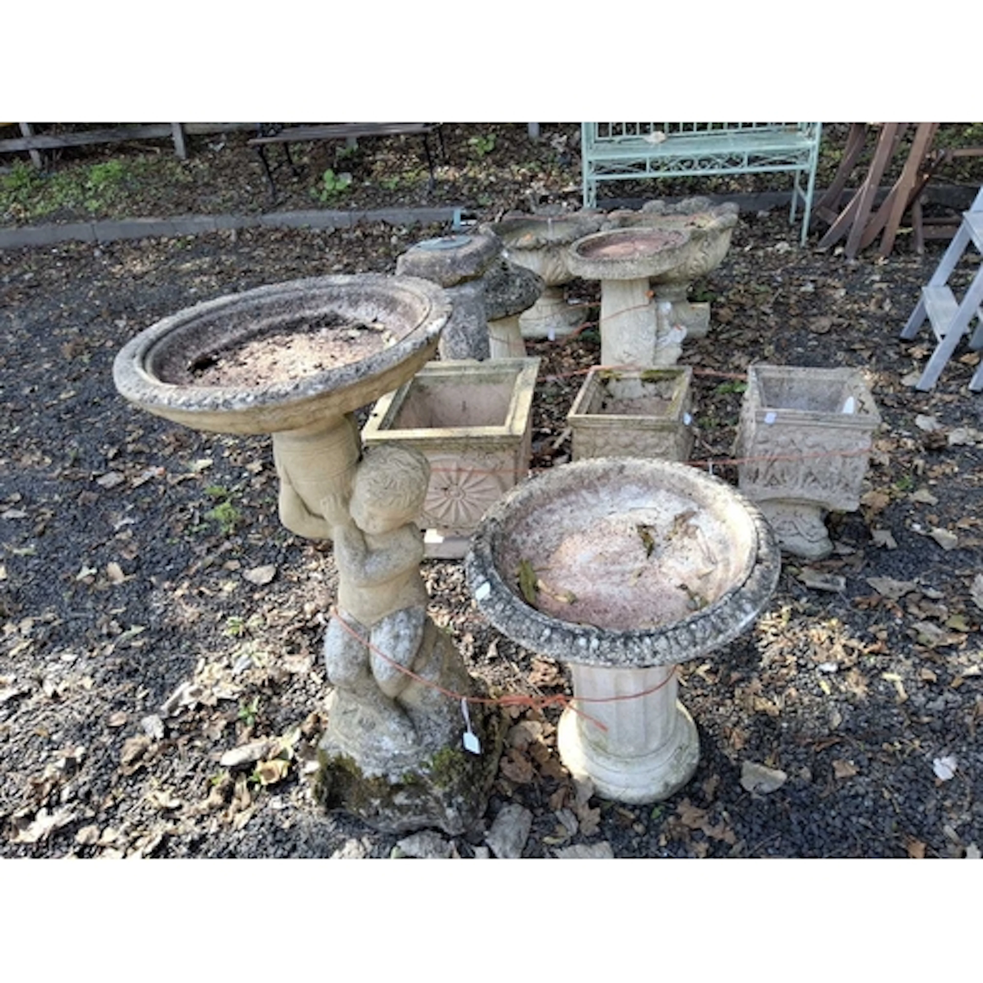 TWO CONCRETE BIRDBATHS the largest being 79cm high in the fo...