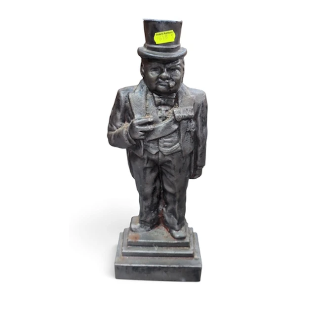 Cast-iron doorstop modelled as Winston Churchill in a top ha...