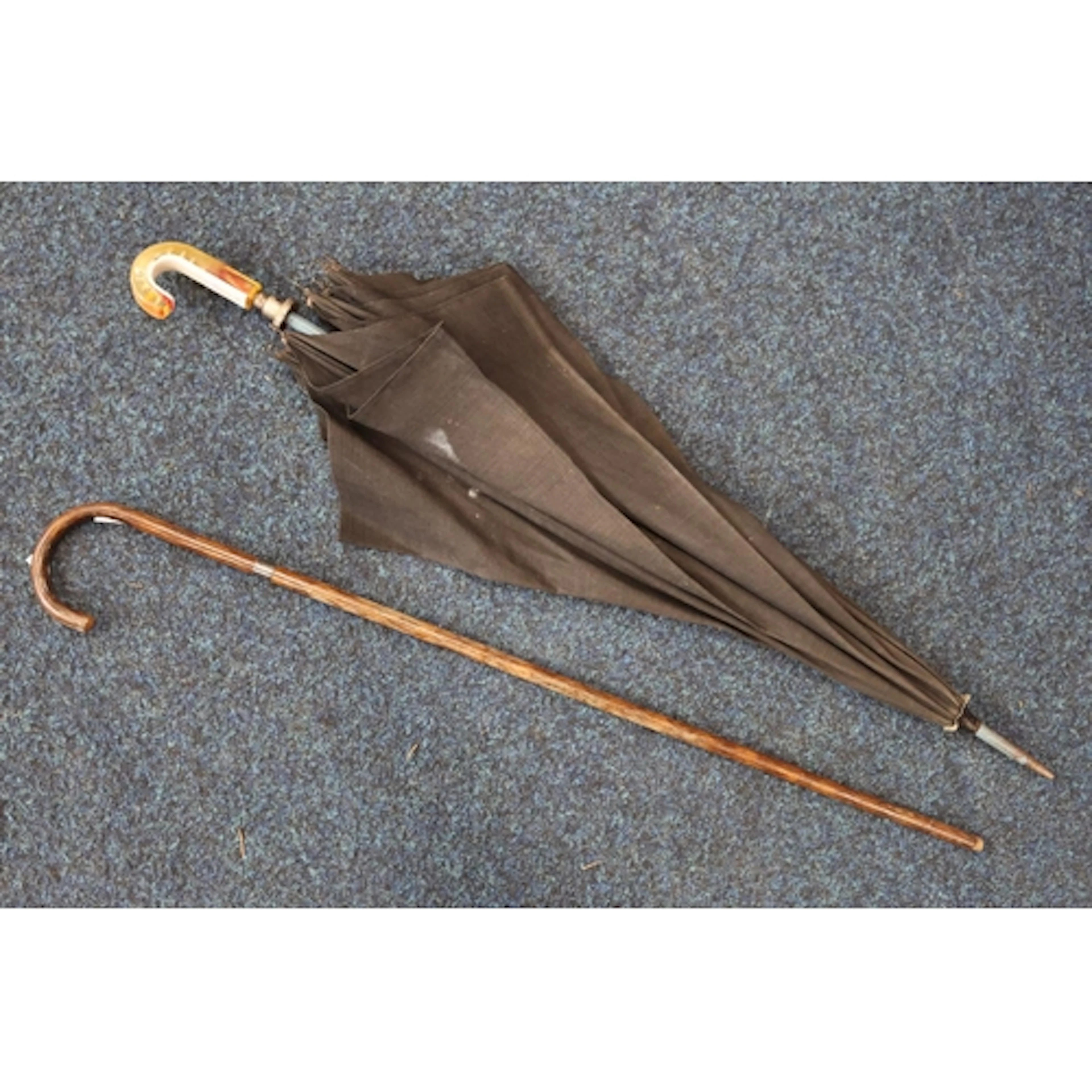 Silver collared short cane and a parasol.