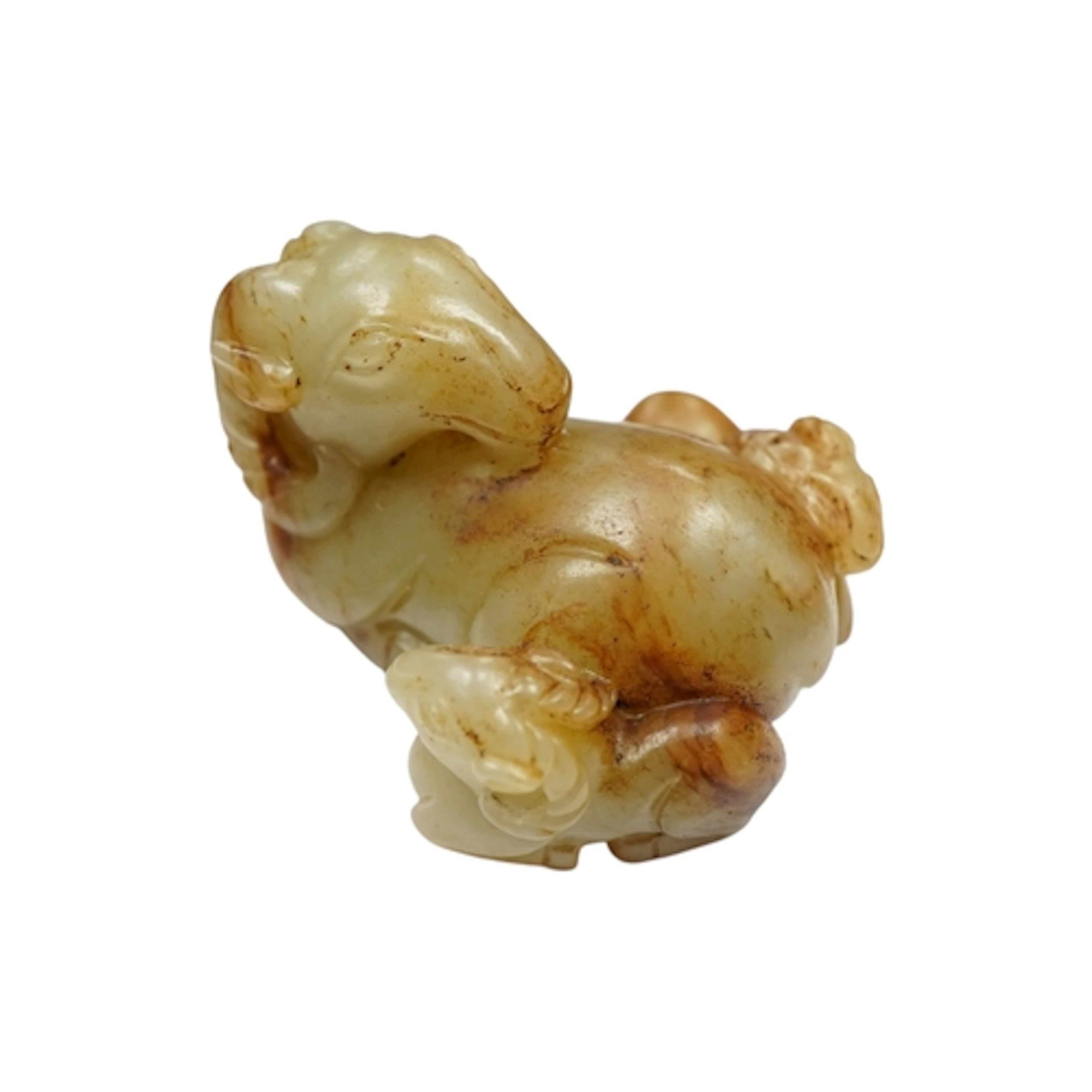 A Chinese celadon and russet jade group of a ram and two kid...