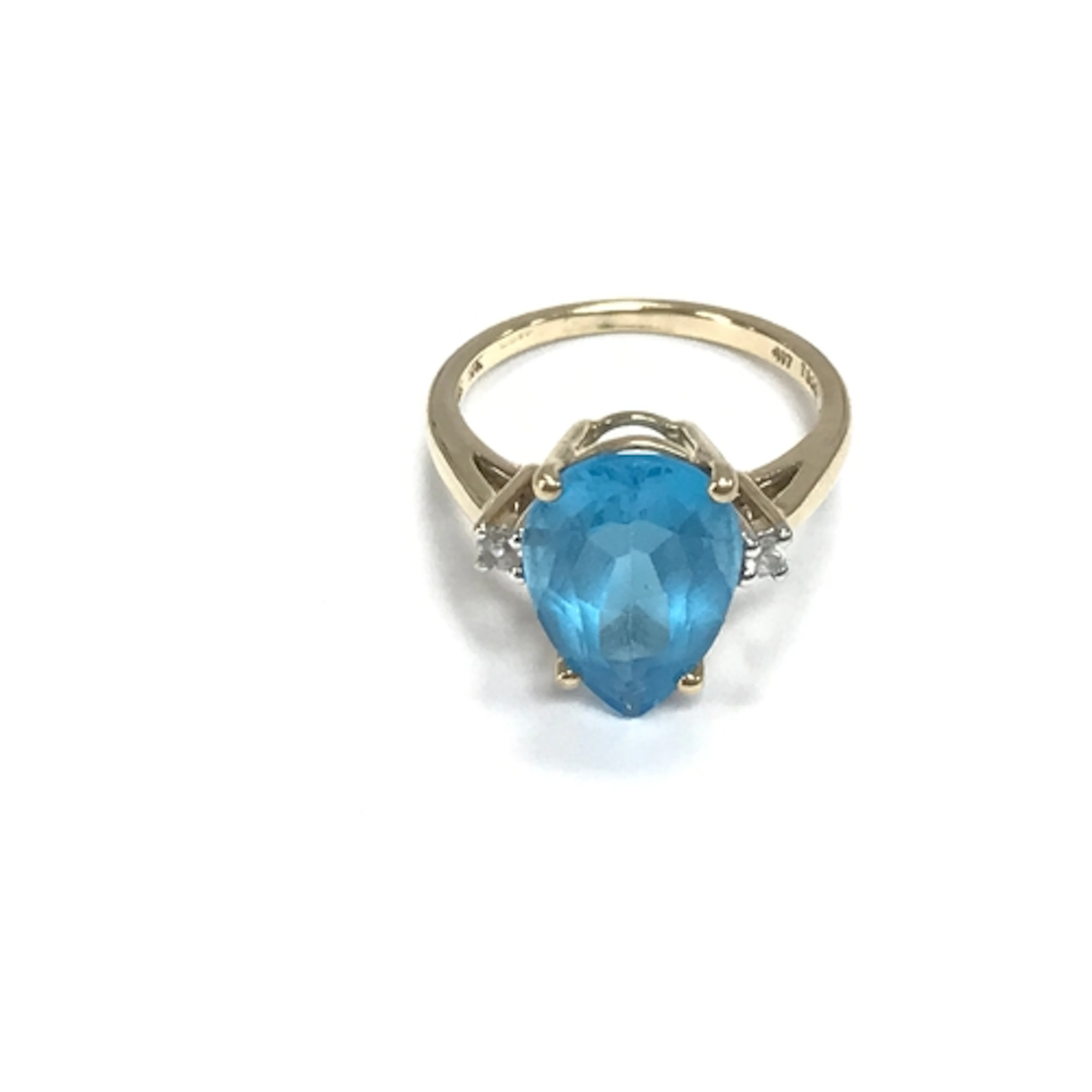 A 9ct gold ring set with pear shaped blue stone. Size L and ...