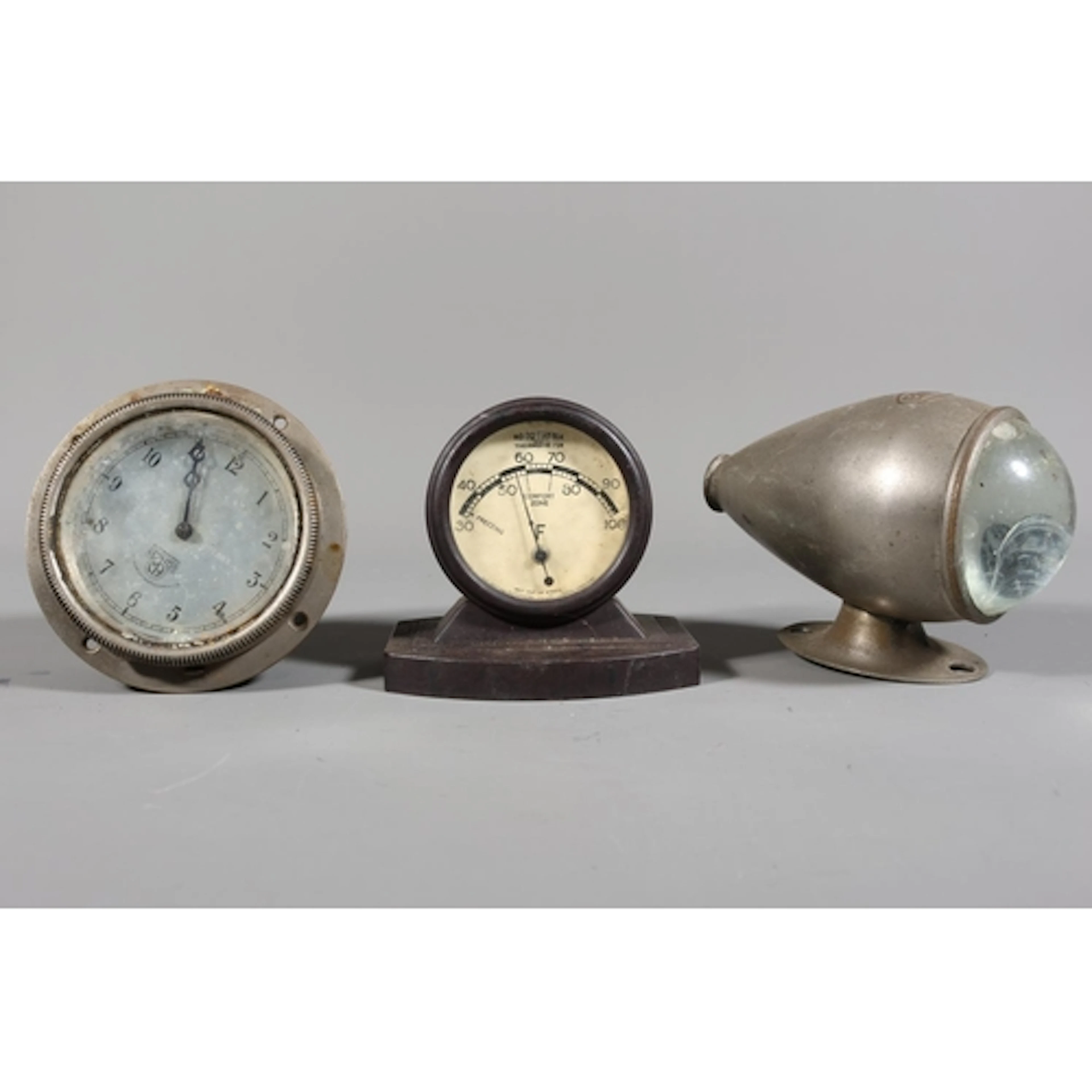 Smiths car clock, a Brolt bullet side lamp, and a Bakelite R...
