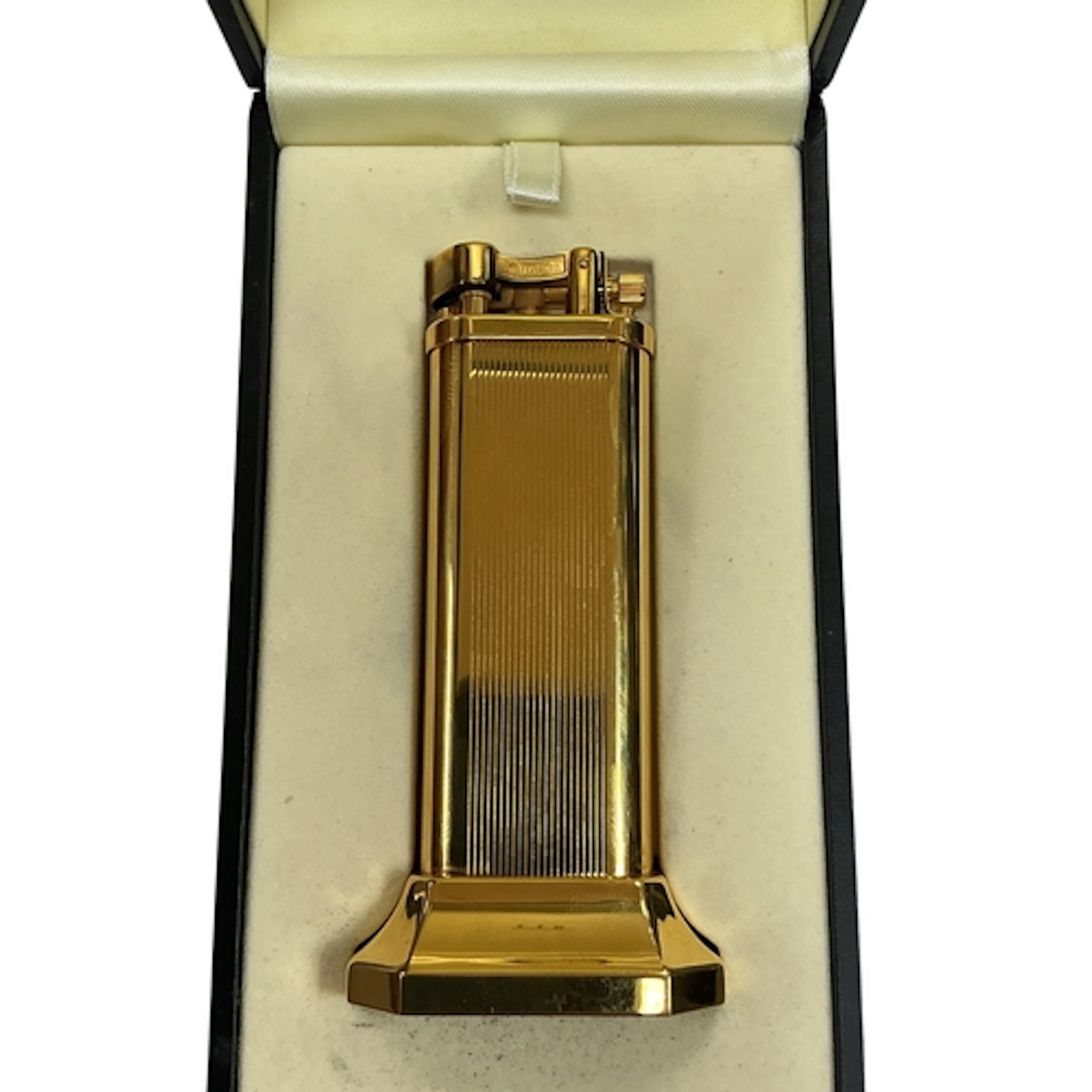 A Dunhill Arm Lift gold plated table lighter, stamped marks ...