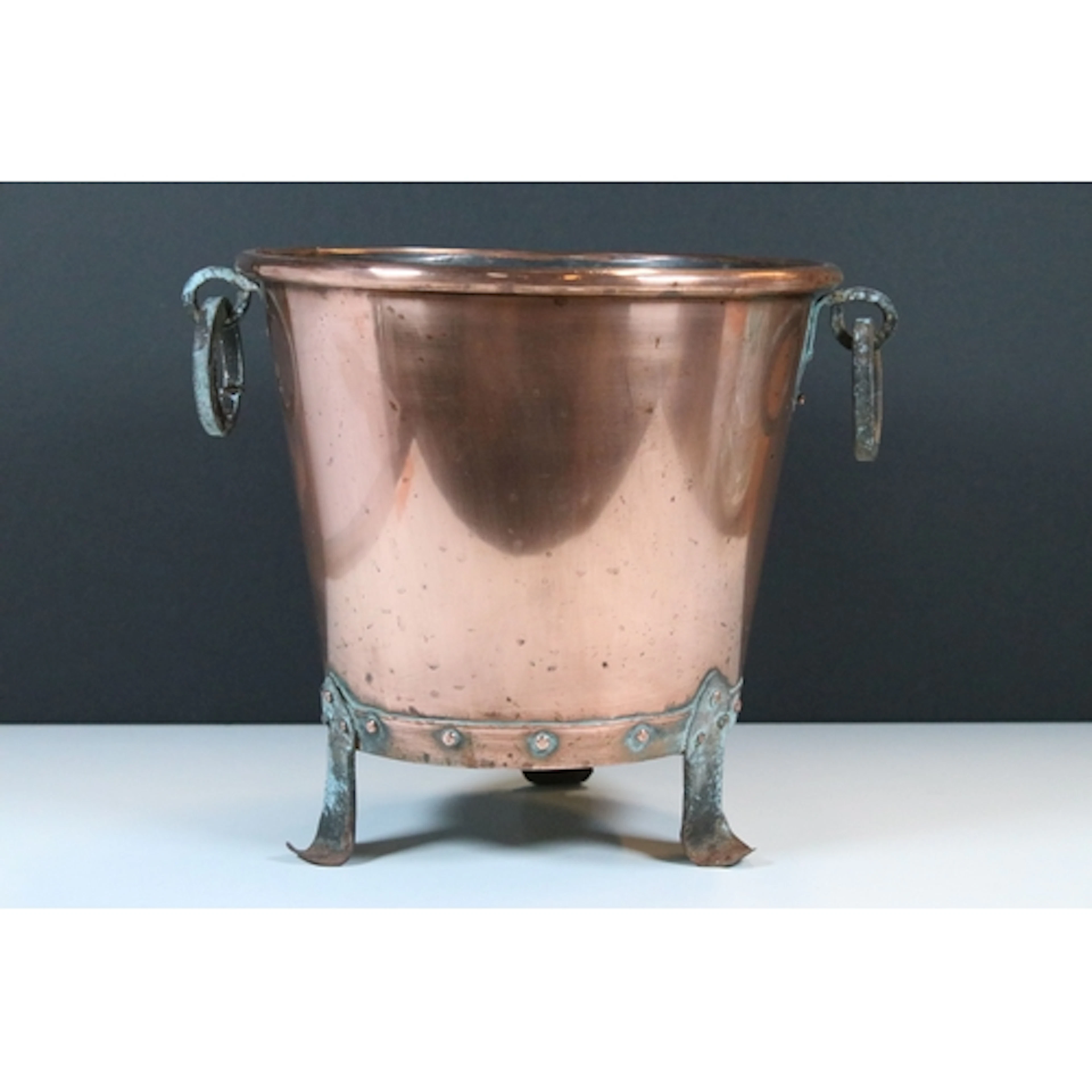 Arts & Crafts copper planter of round tapering form with stu...