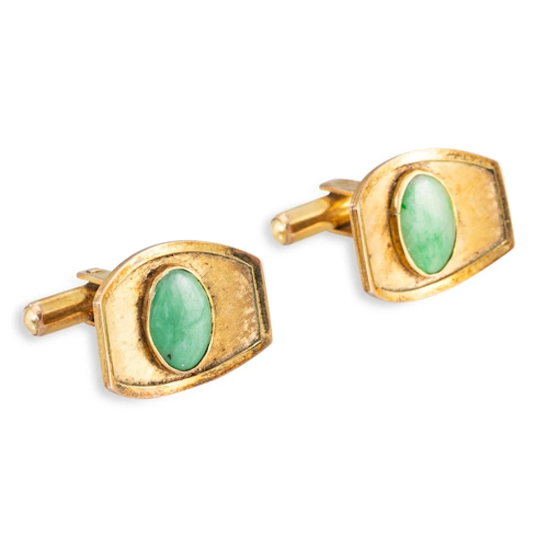 A PAIR OF JADE CUFFLINKS, the oval cabochon jade to concave ...