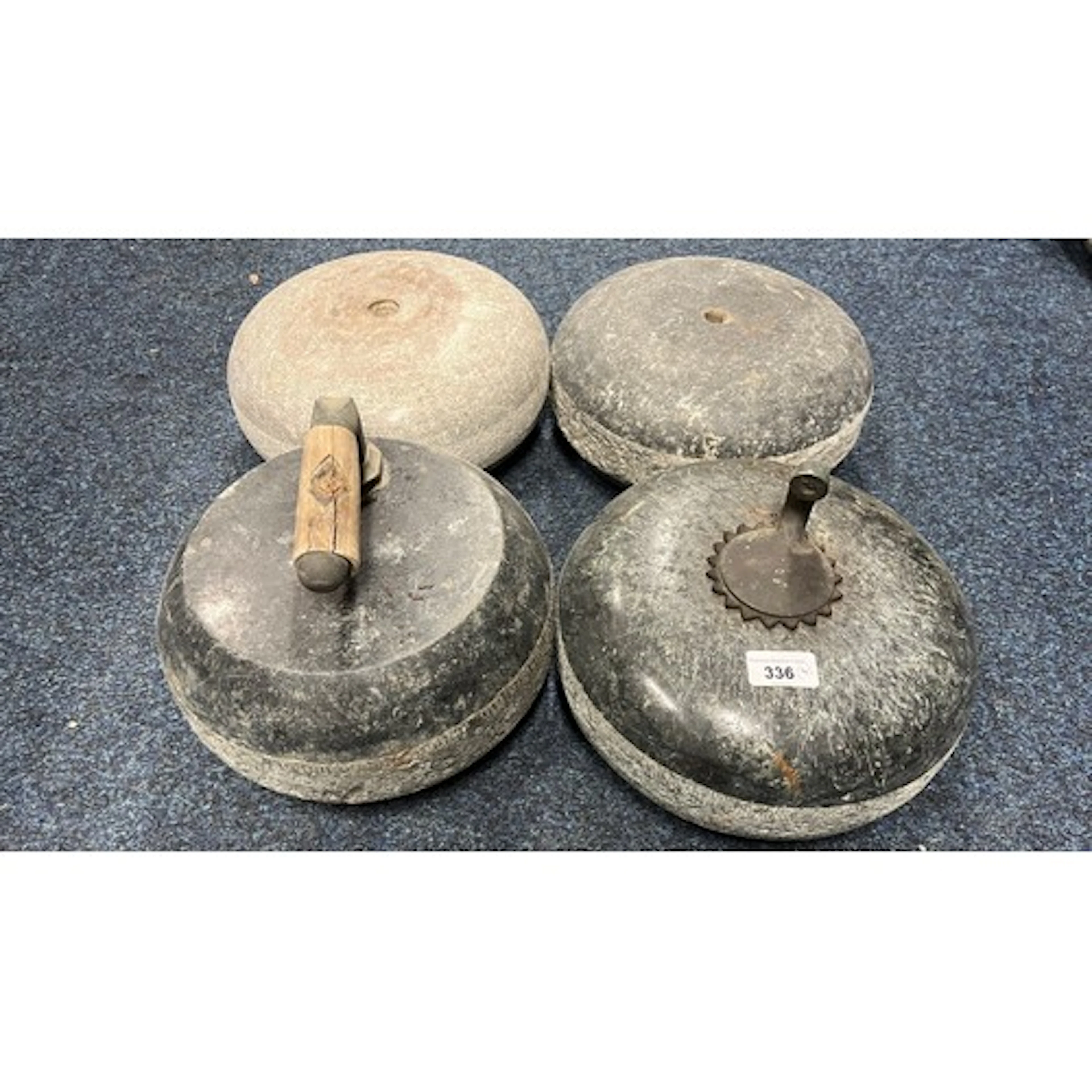 Group of four curling stones.