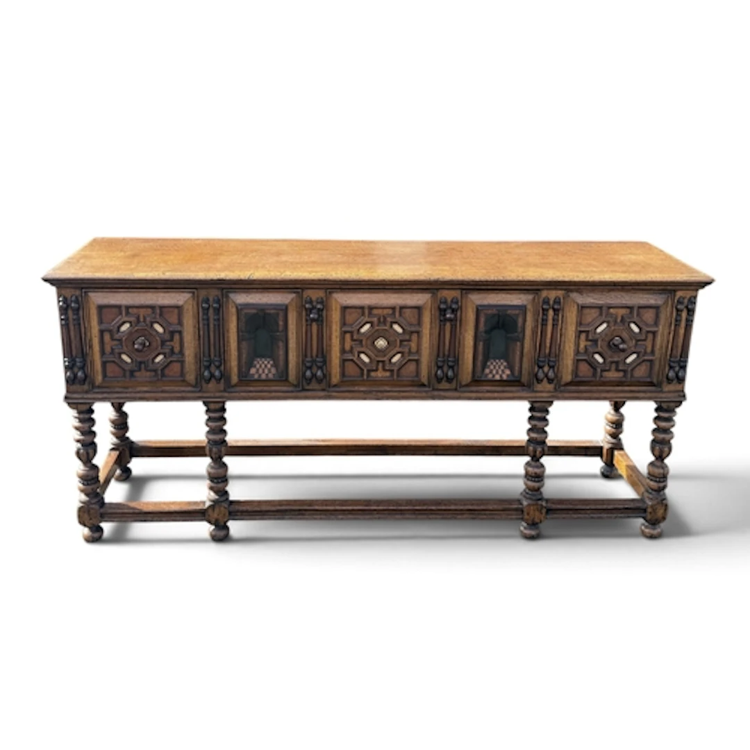 A 17TH CENTURY STYLE ITALIAN OAK LOW DRESSER, FITTED WITH DR...