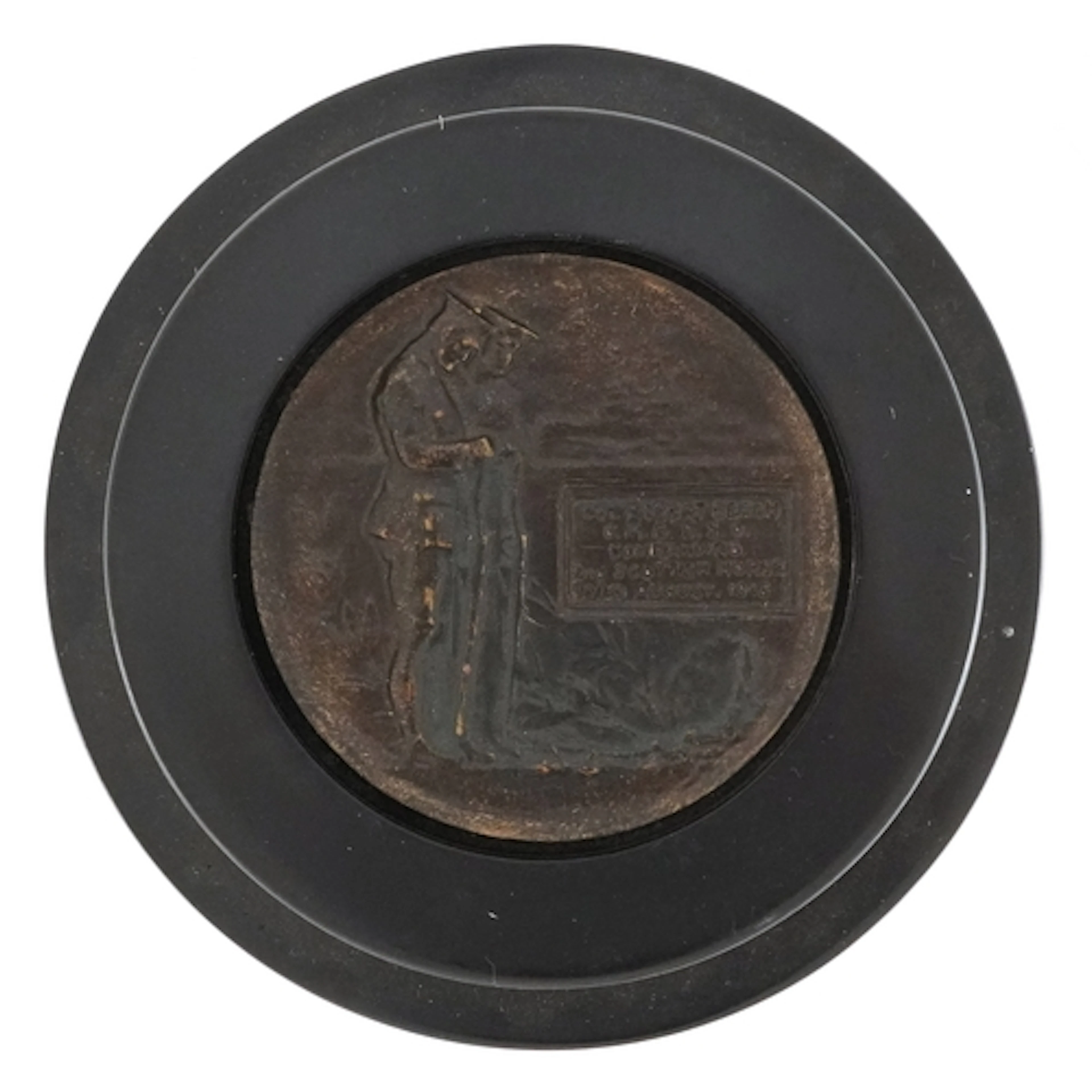 Military interest patinated bronze plaque in an ebonised cas...