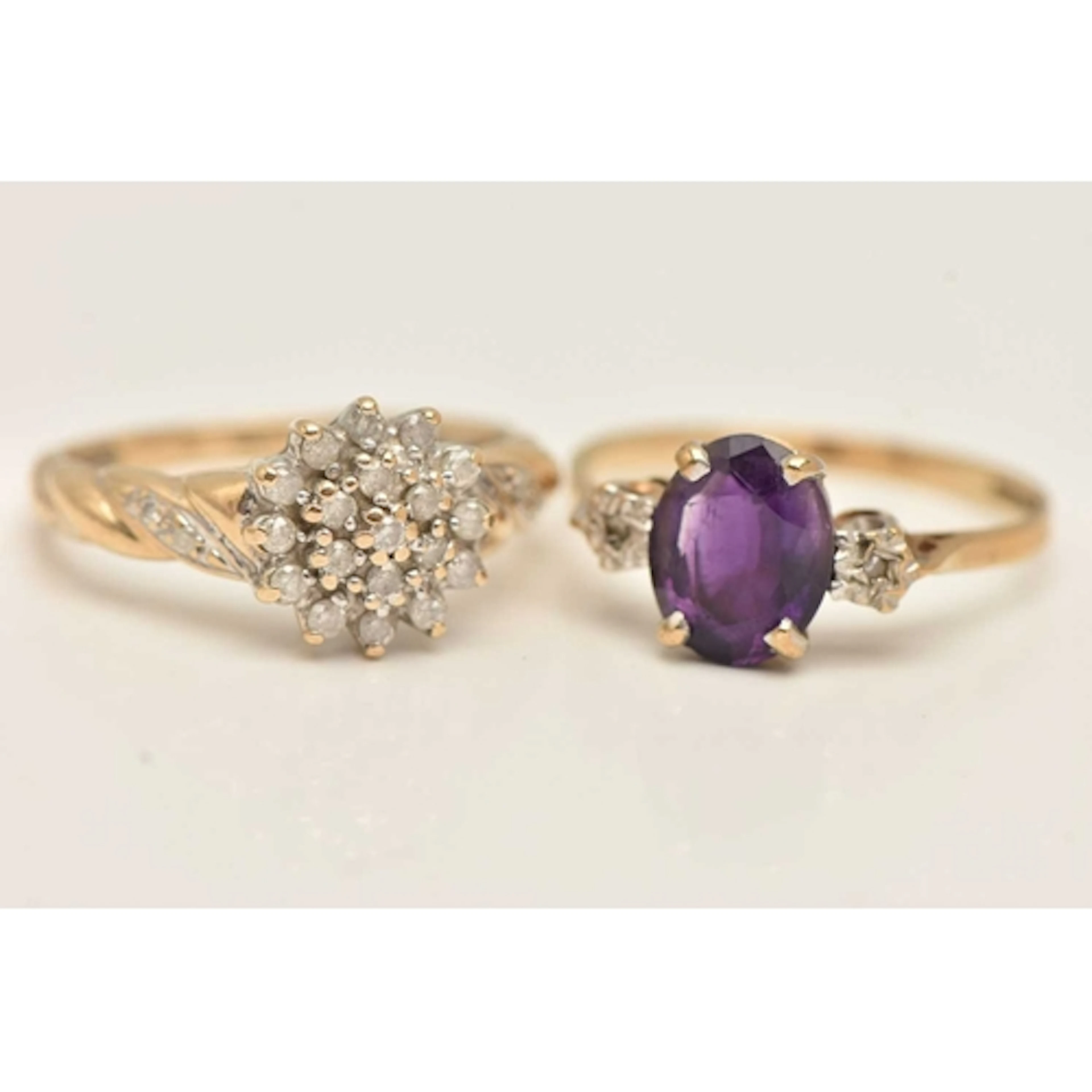 TWO 9CT GOLD GEM SET RINGS, the first an amethyst and illusi...