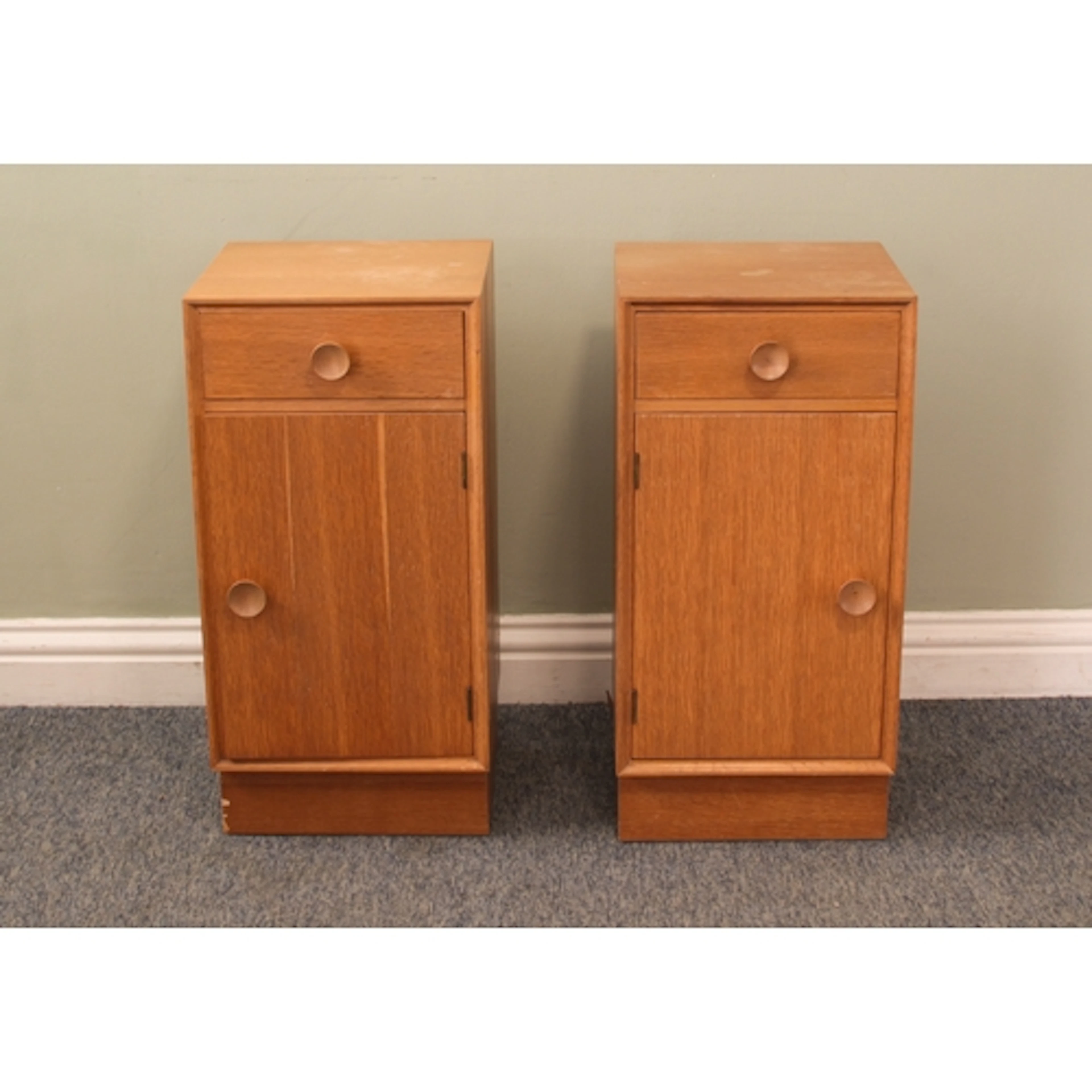 A pair of vintage light oak veneered bedside cabinets by Mer...