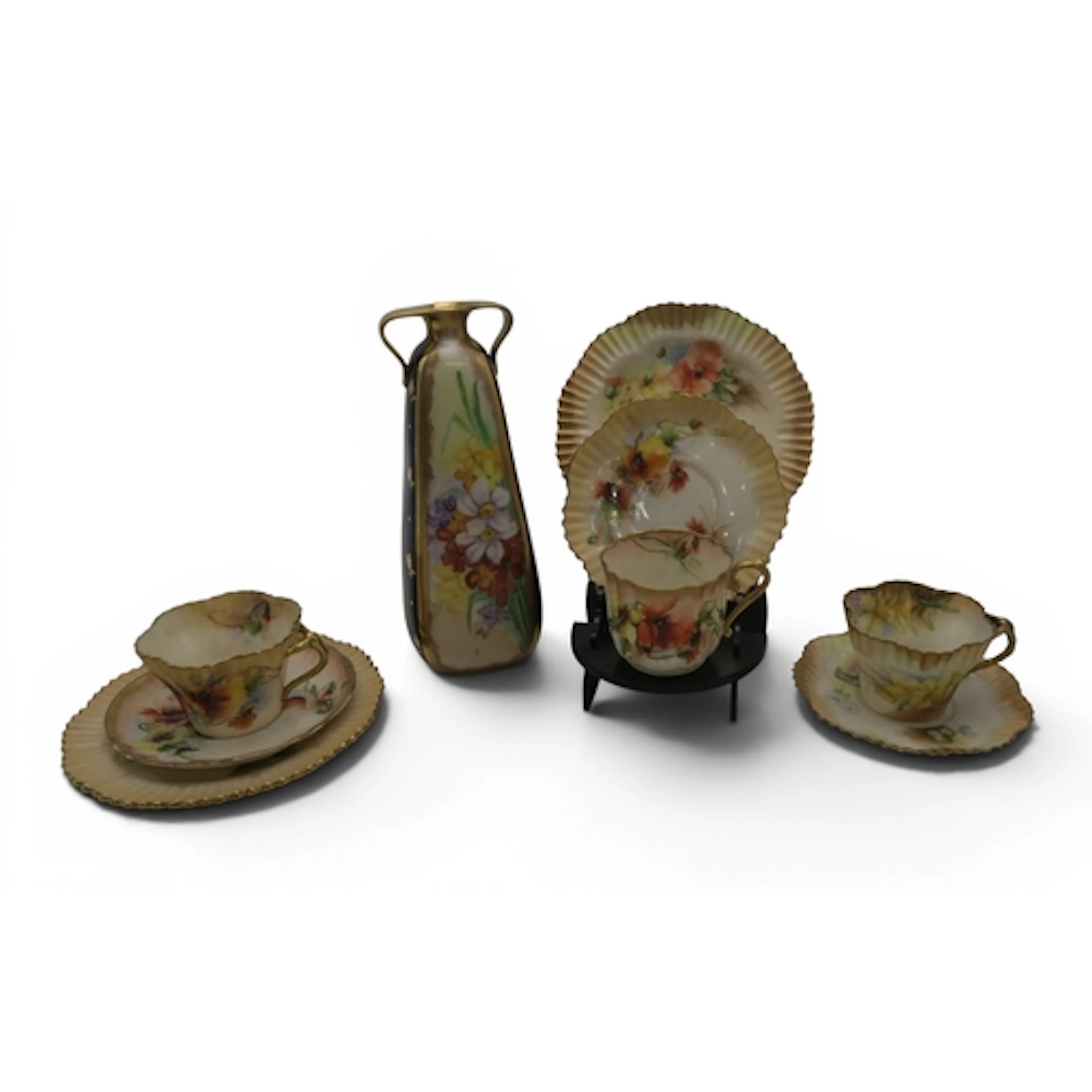 TWO NAUTILUS PORCELAIN TRIOS hand painted with poppies, a fu...