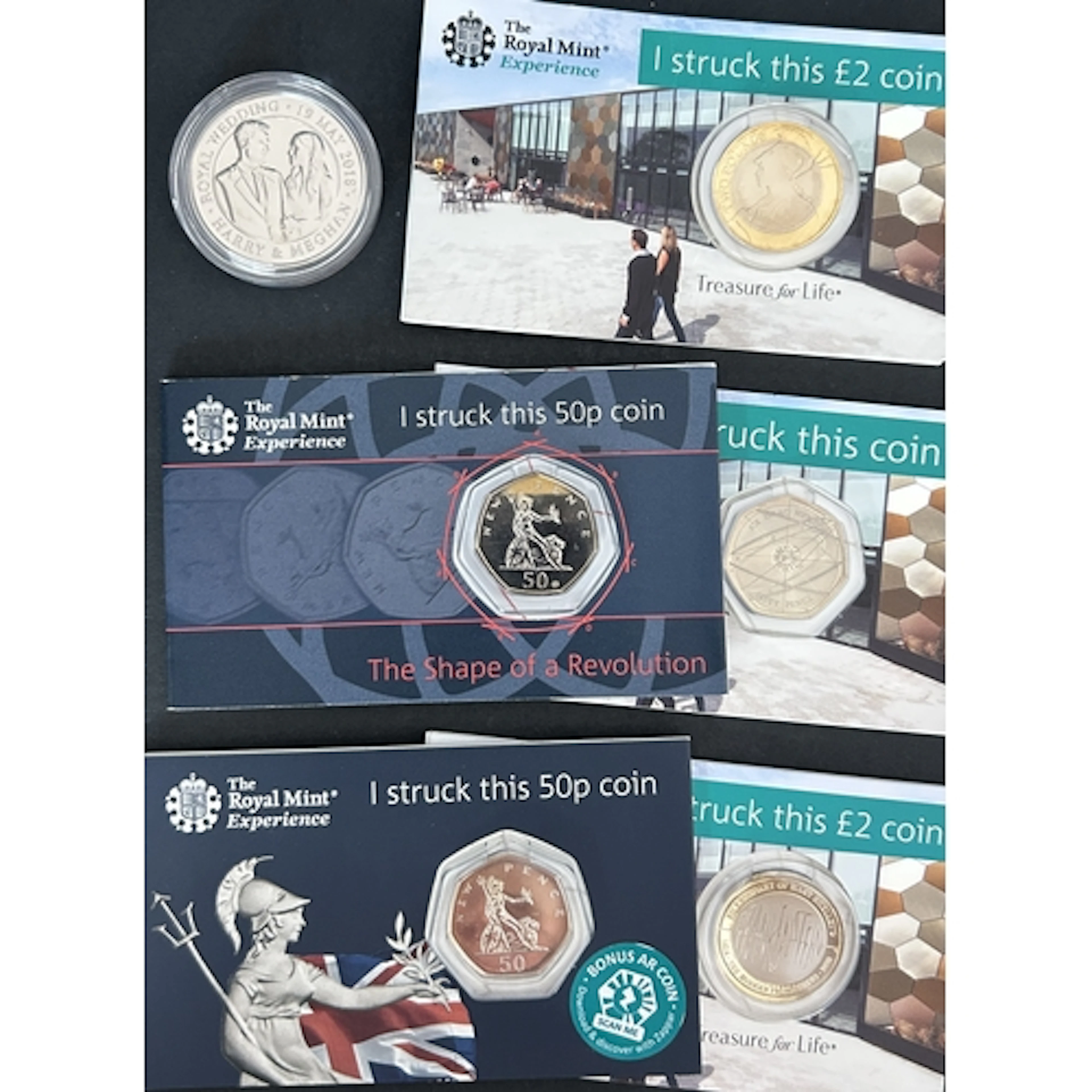 A group of six Royal Mint Experience Strike Your Own cupro-n...