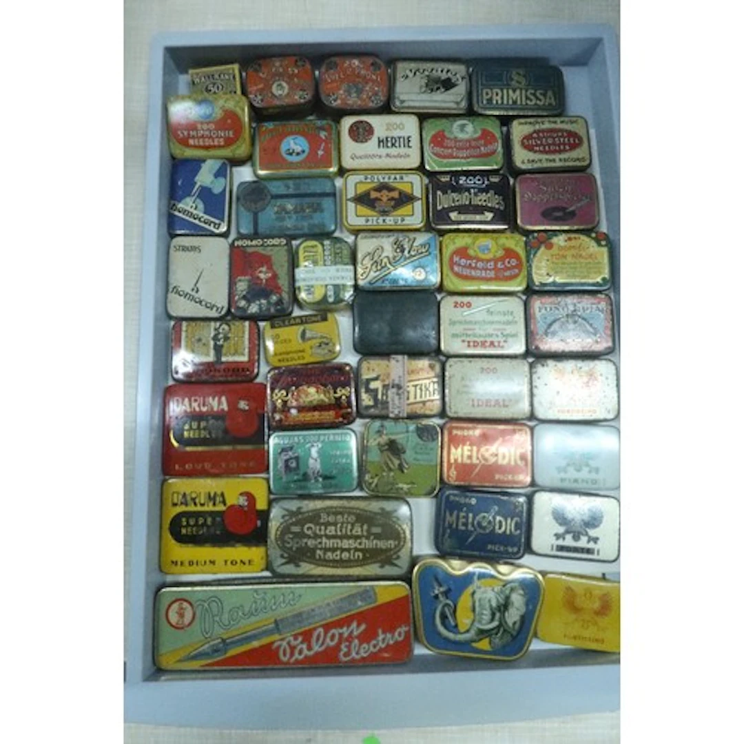 A tray of vintage gramophone needle tins