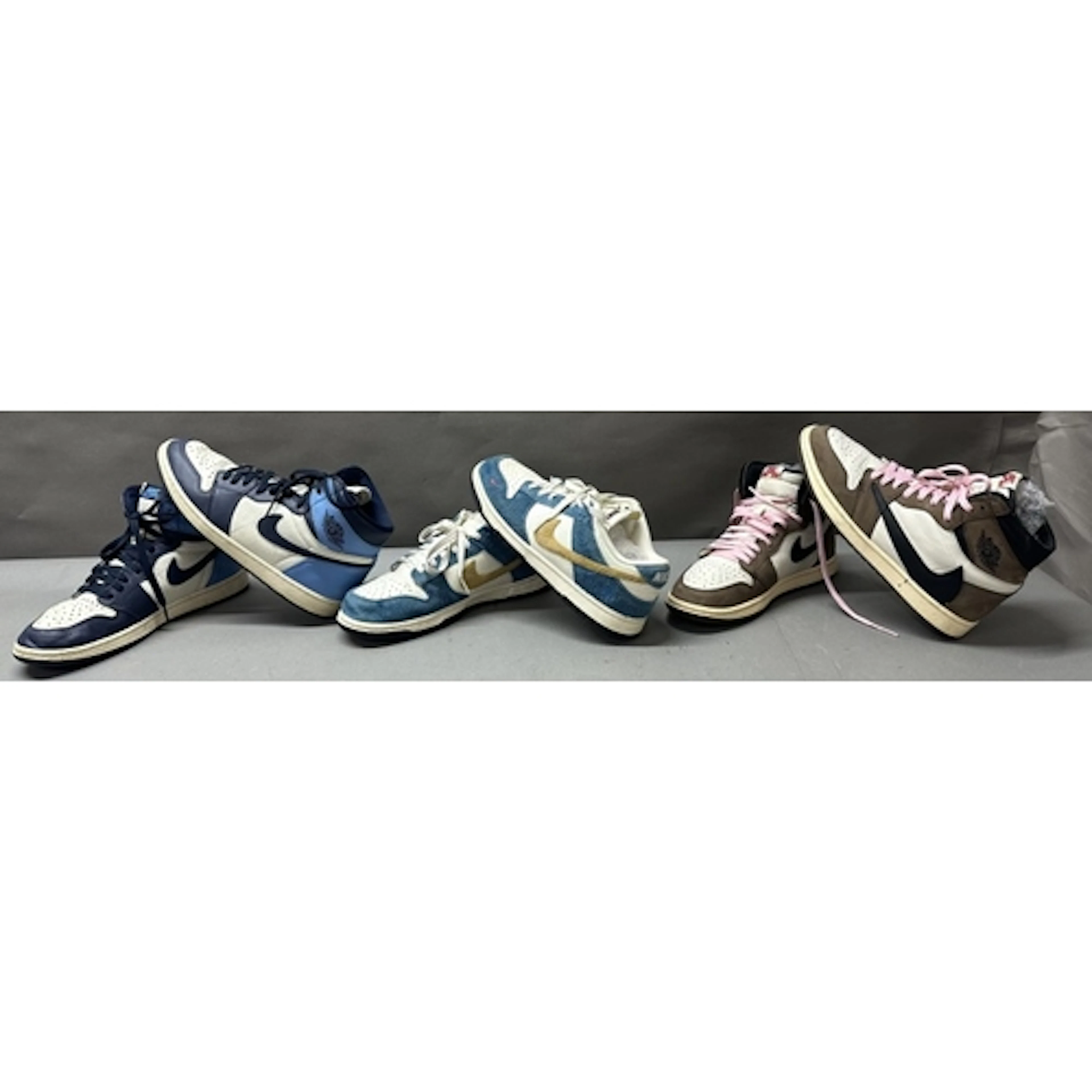 Three pairs of used mens size UK9.5 Nike Trainers to include...