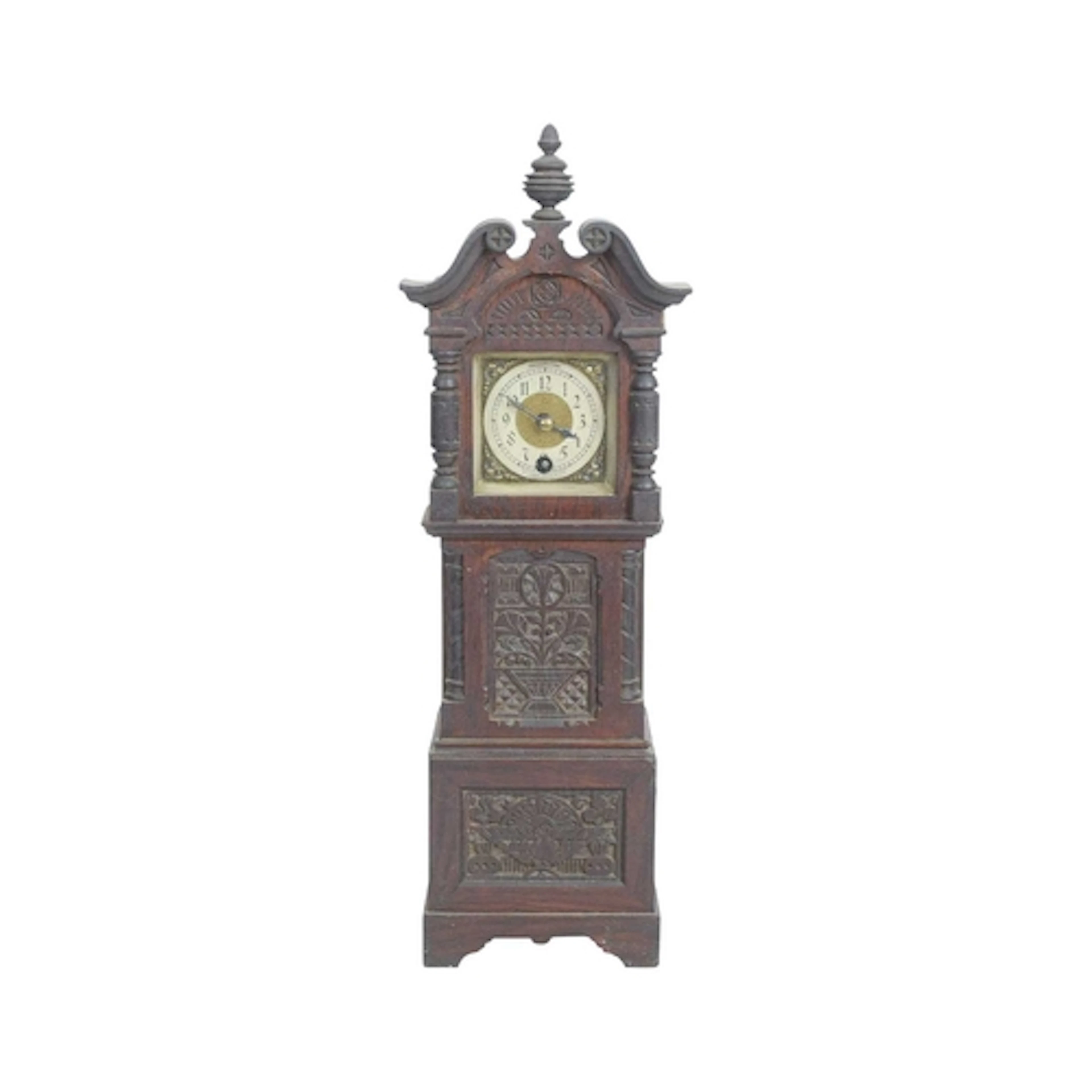A late Victorian carved oak miniature longcase clock. With a...