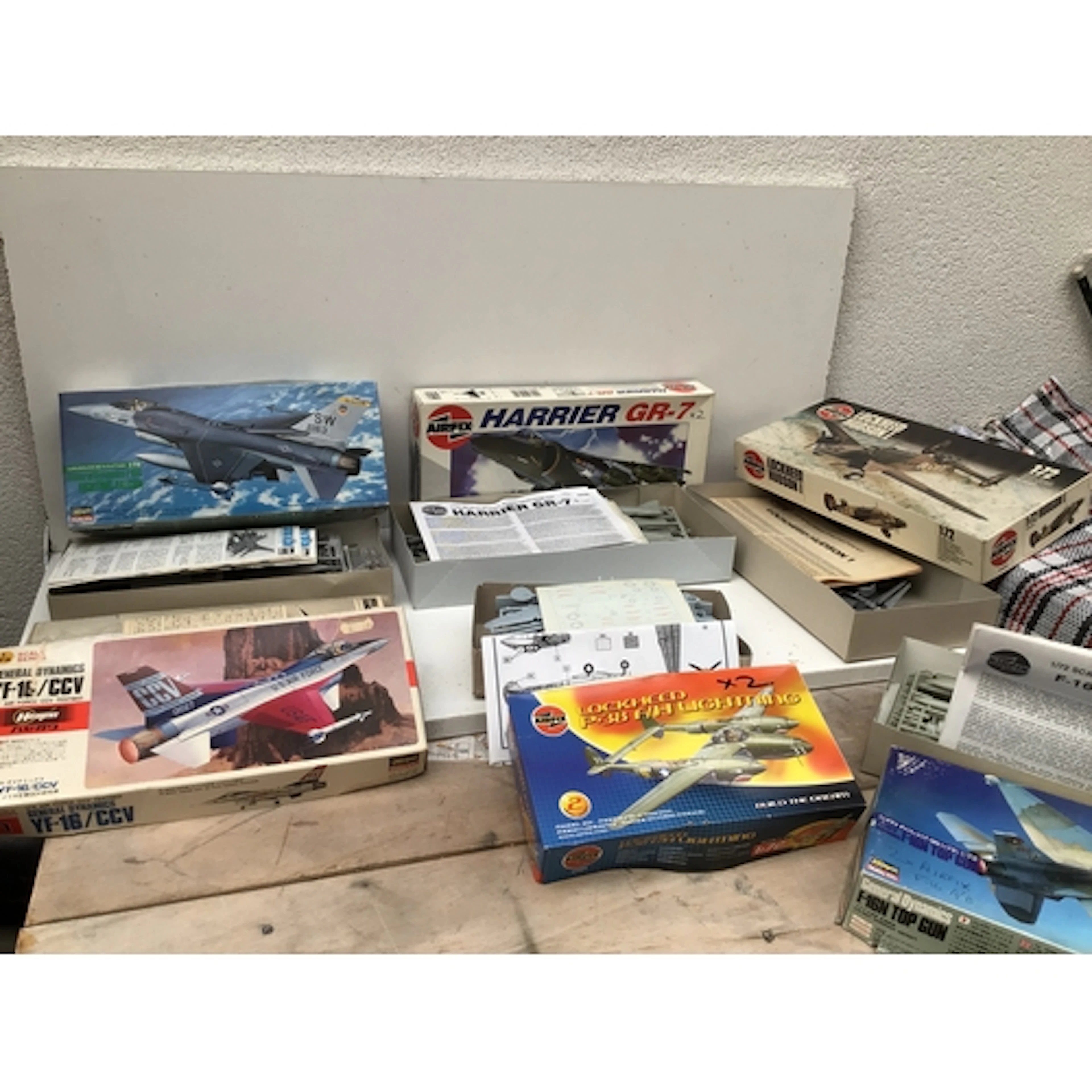 A collection of boxed model kits model kits comprising aircr...
