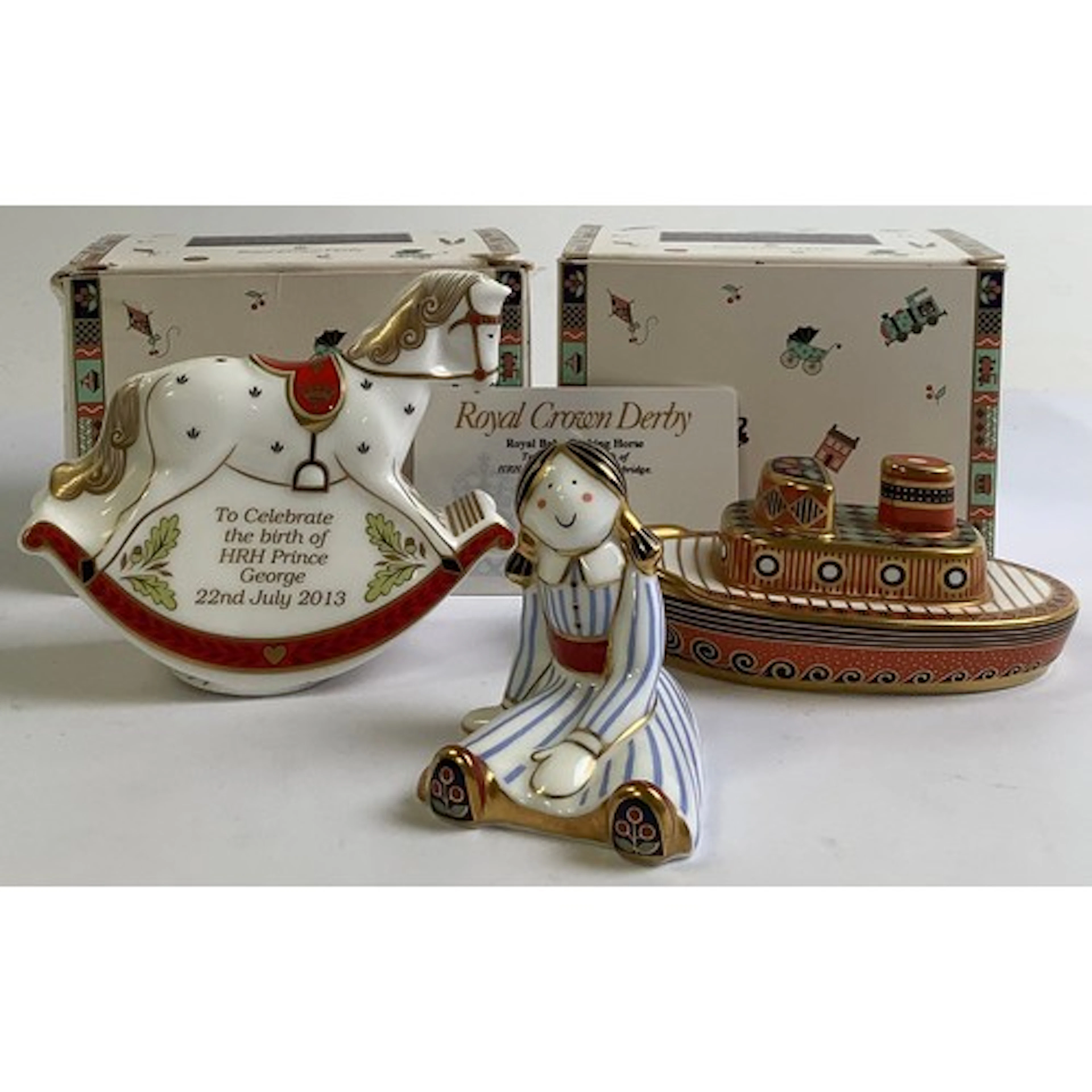 Three Royal Crown Derby miniature paperweights from the Trea...