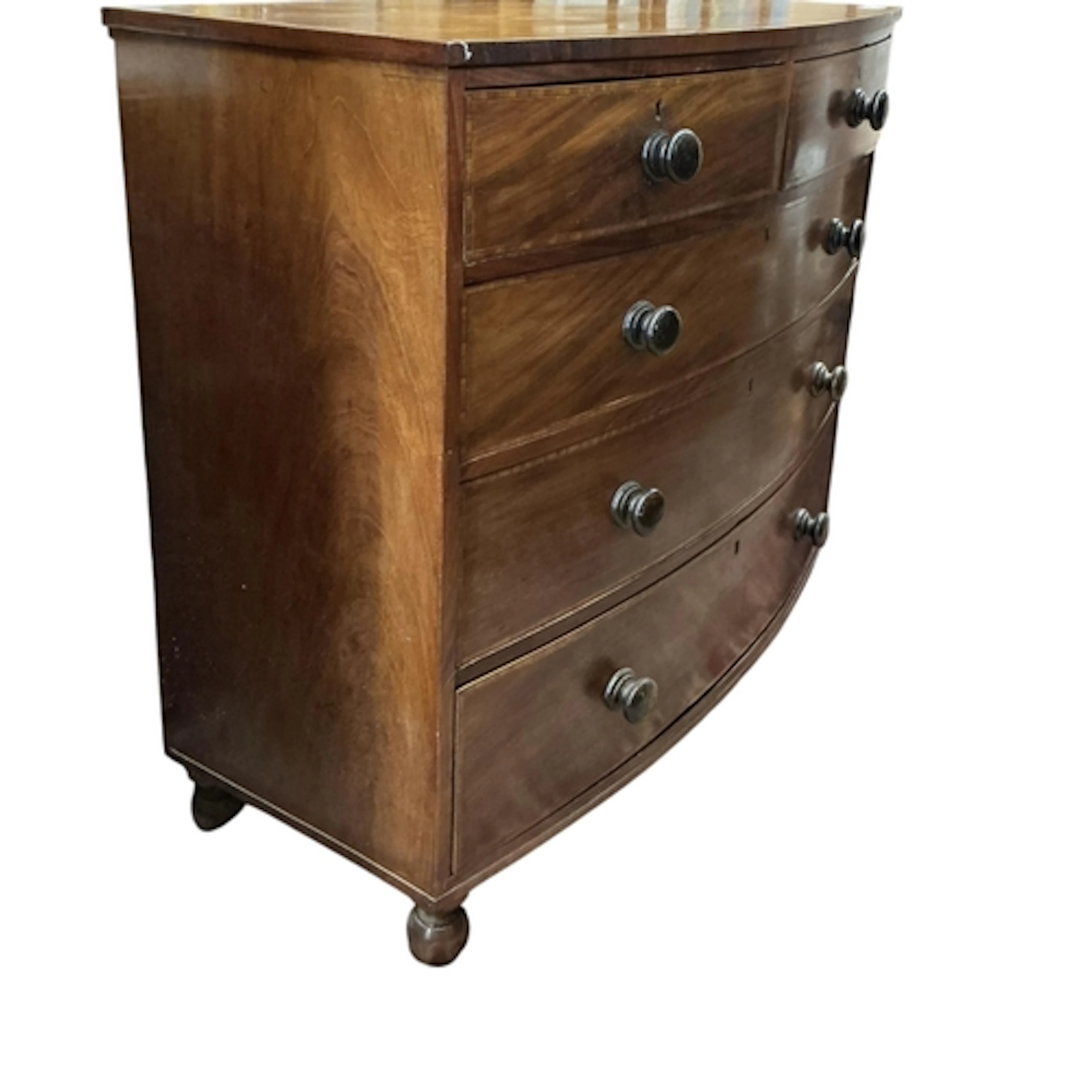 A Victorian bow fronted mahogany chest of drawers, two short...