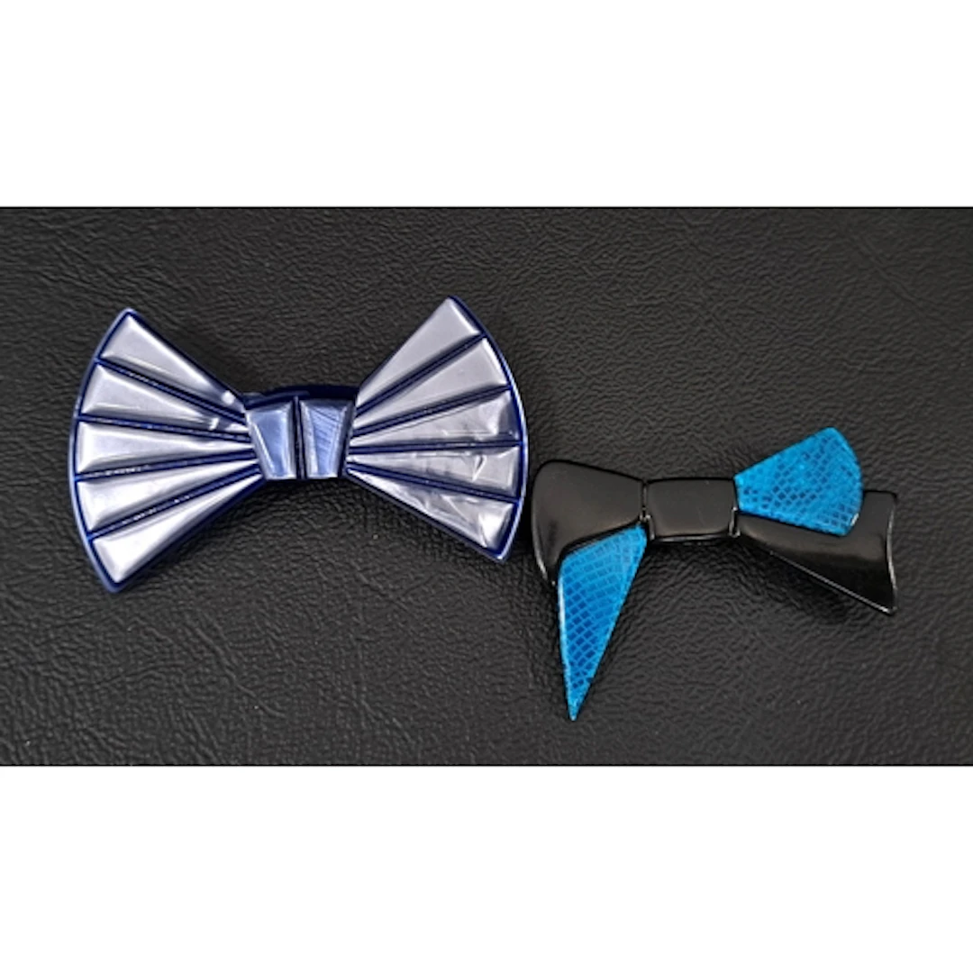 TWO LEA STEIN BOW BROOCHES one in opalescent blue and the ot...