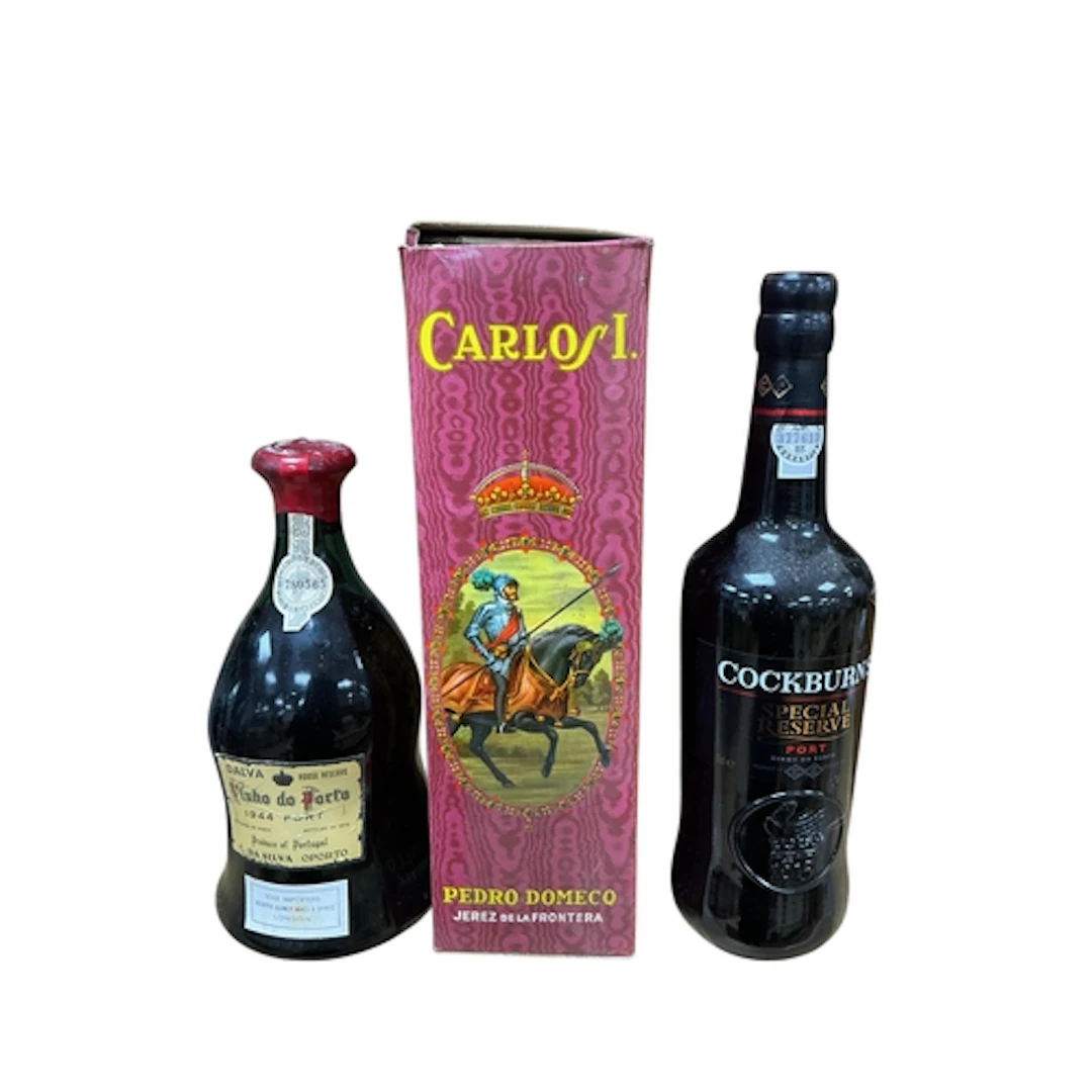 A bottle of Vinho Do Porto 1944 vintage port, a bottle of Co...
